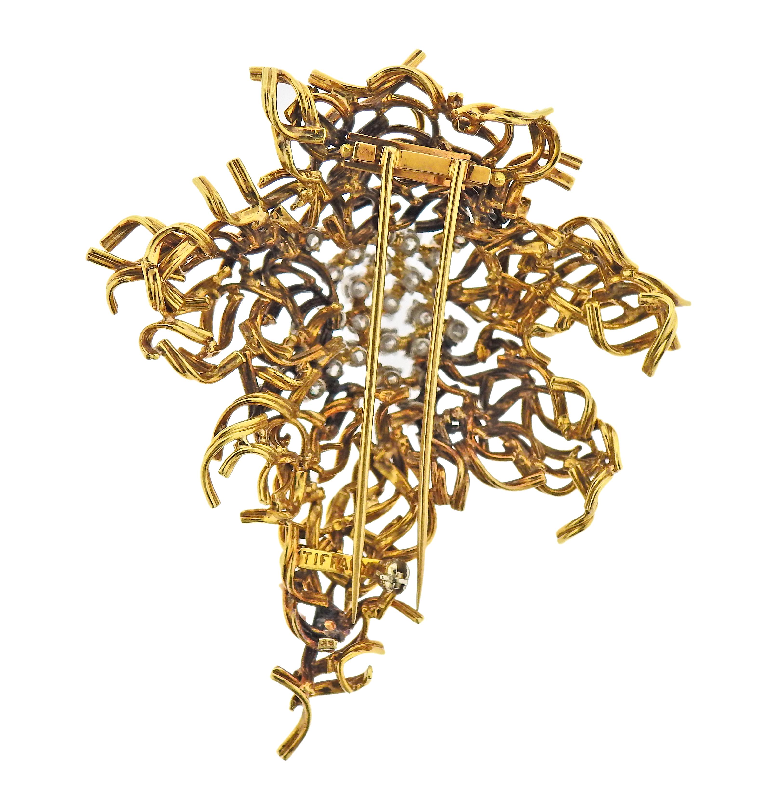Vintage 18k gold brooch by Tiffany & Co, can be worn as a pendant. Adorned with approx. 2.50ctw in diamonds. Brooch measures 68mm x 58mm. Marked: Tiffany, 18k. Weight - 35.8 grams. 
