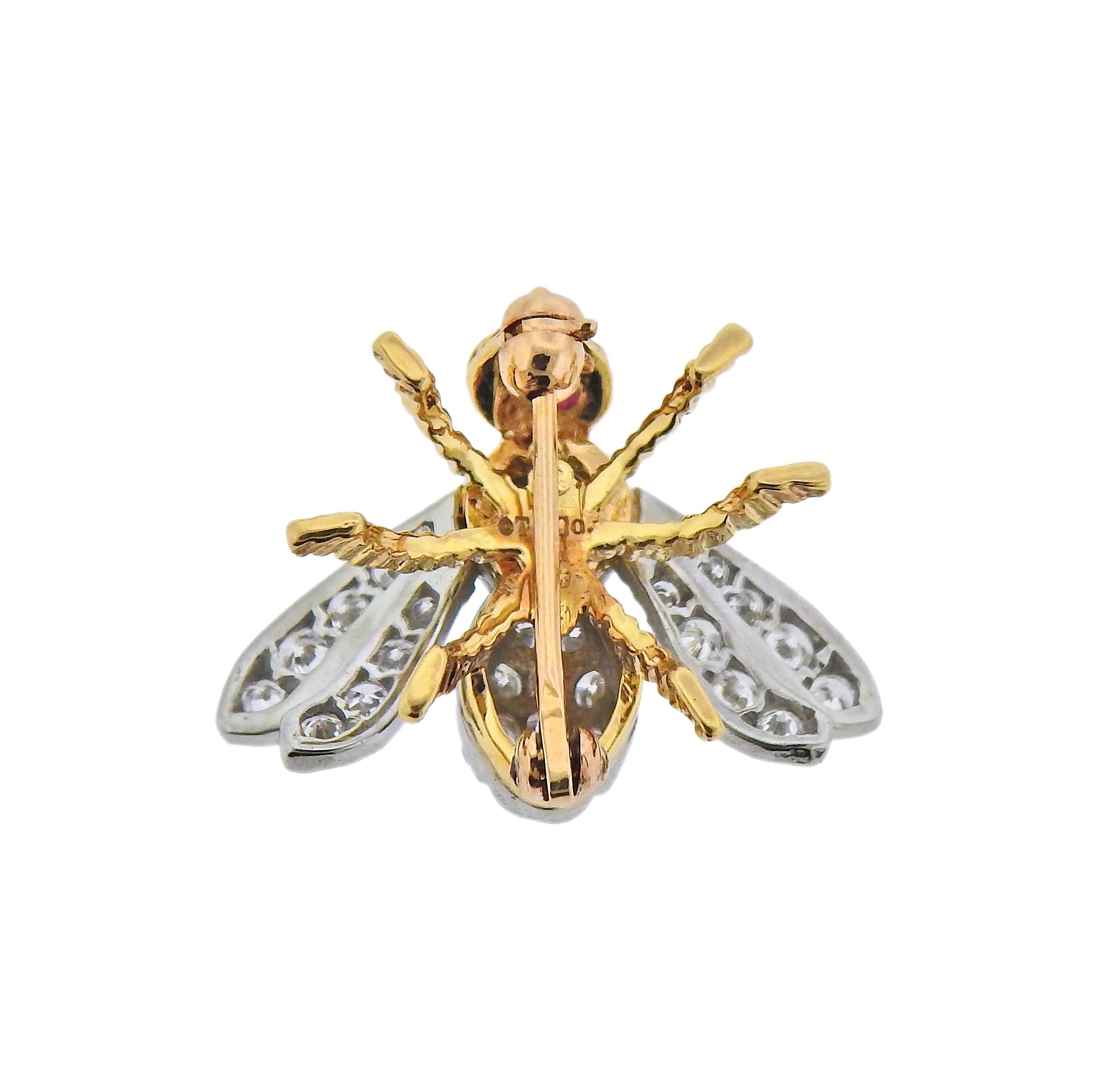 Tiffany & Co 18k gold bee brooch, with approx. 0.60cts in G/VS diamonds and ruby eyes. Brooch is 17mm x 20mm. Weight - 3.2 grams. Marked: Tiffany & Co, 750. 
