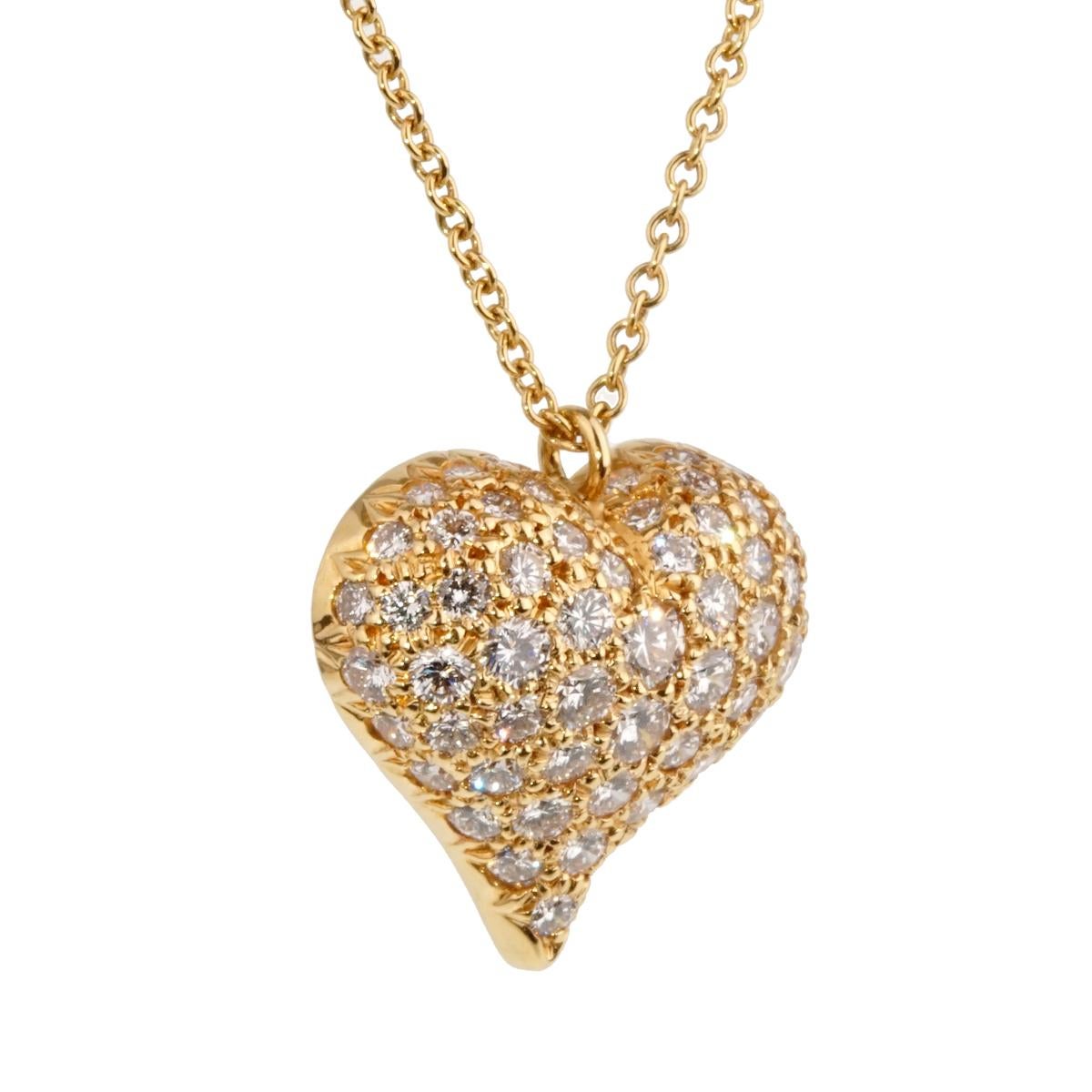 A fabulous Tiffany & Co diamond necklace featuring a puffed heart set with the finest Tiffany & Co round brilliant cut diamonds in 18k yellow gold.