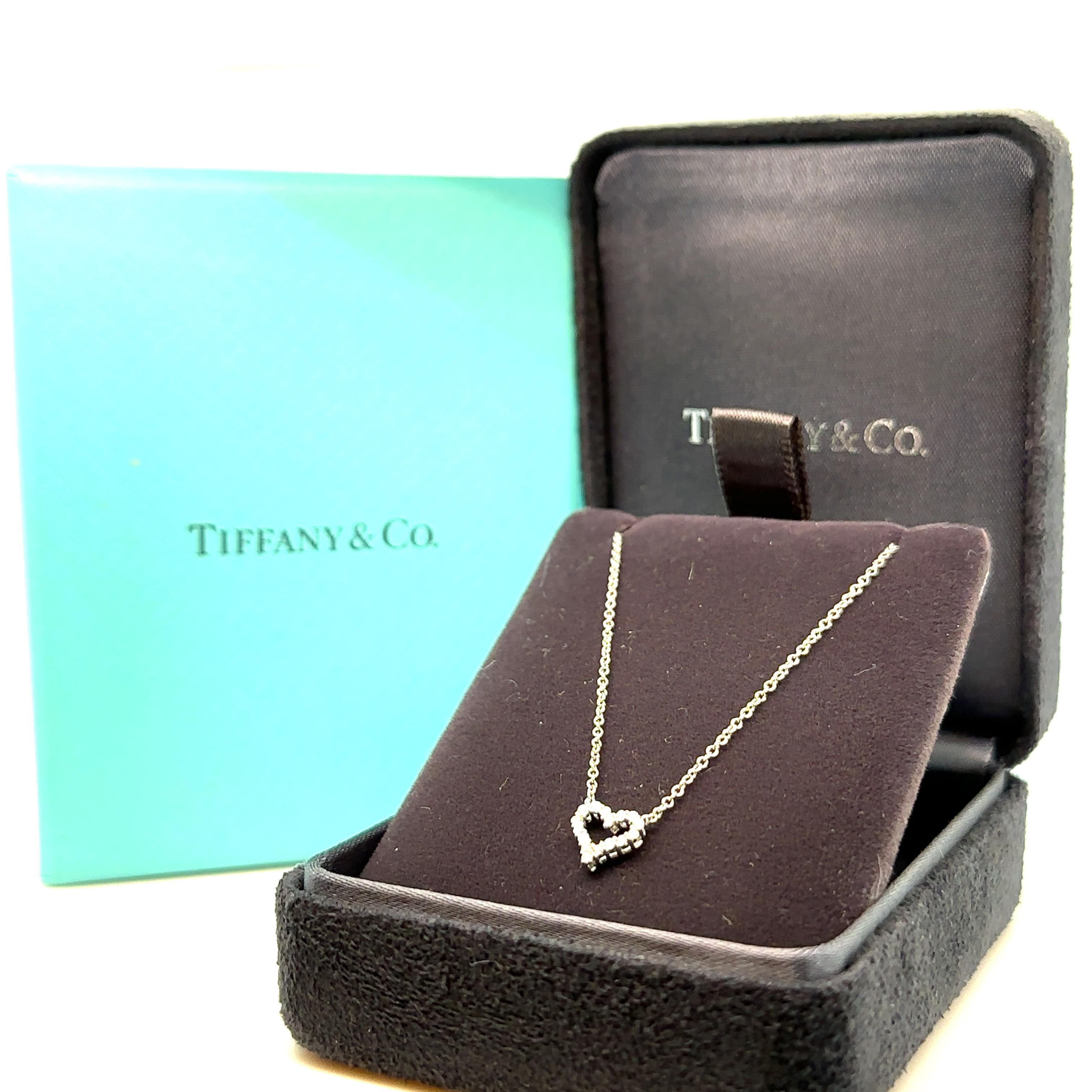 Unique features: 

Tiffany and Co. diamond heart pendant. Made of 950 Platinum, and weighing 2.4 grams. Stamped: Pt950.

Set with 16 round, brilliant cut Diamonds, colour F and clarity VS. with a total weight of 0.20ct.

Metal: Platinum
Carat: