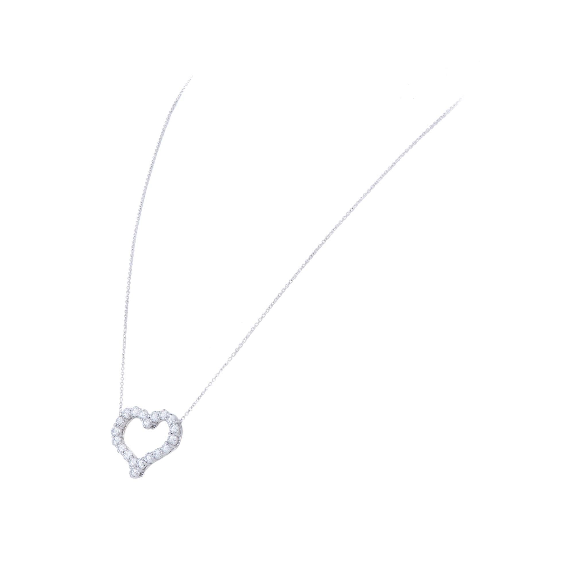 Authentic Tiffany & Co. pendant necklace crafted in platinum.  The dazzling heart pendant is set with approximately 1.96 carats of high-quality round brilliant cut diamonds and is situated on a 20 inch chain.  Pendant and chain are Signed Tiffany &