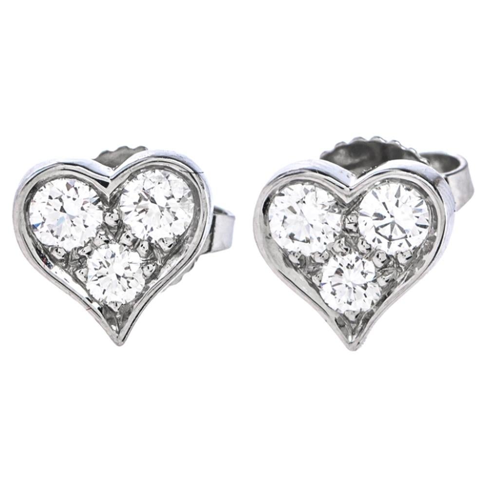 These gorgeous stud earrings from Tiffany & Co. will help you shine a little more! They have been crafted from platinum and designed with hearts that are adorned with round brilliant cut diamonds. They are equipped with push-backs to secure them and