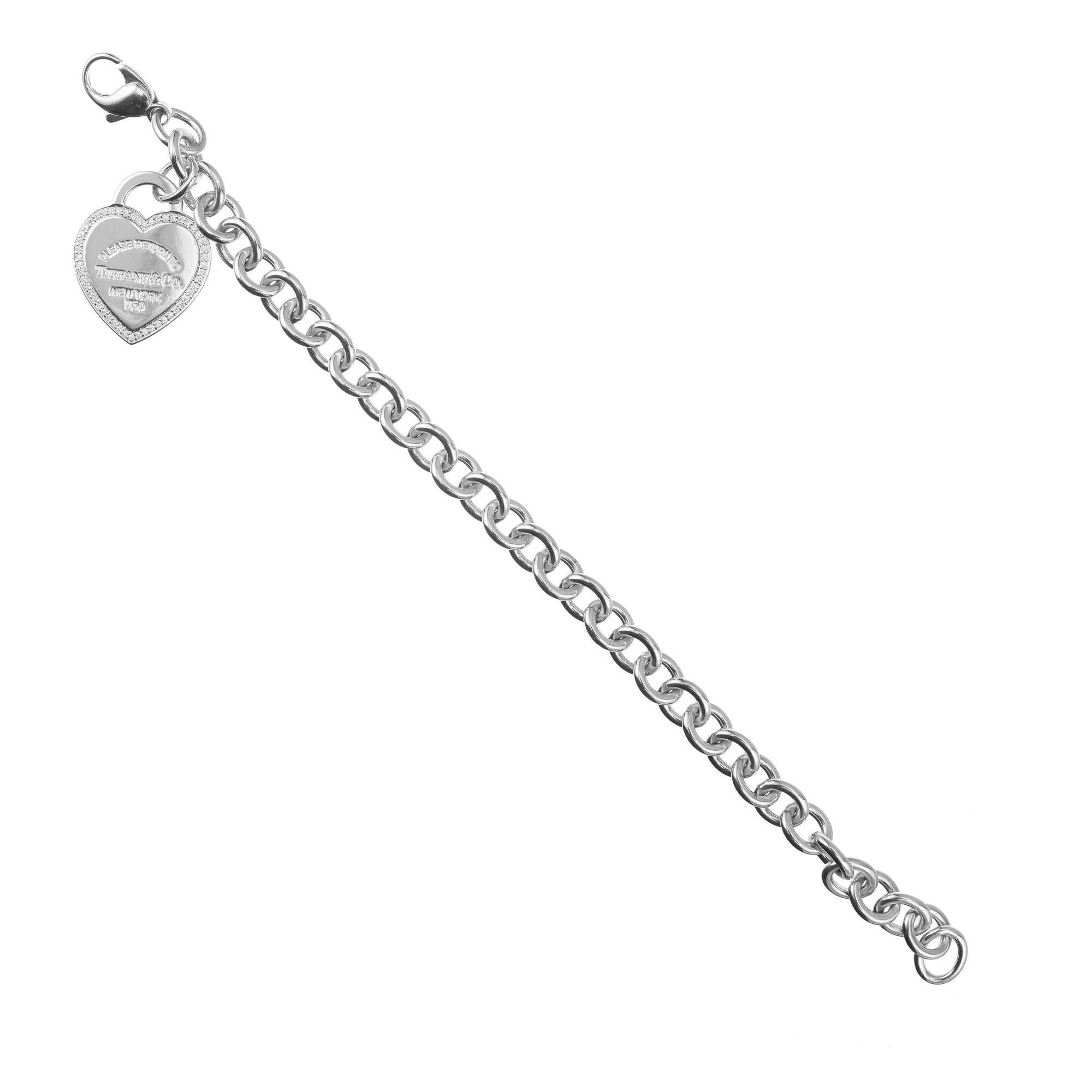 Tiffany & Co diamond heart tag bracelet in 18k white gold. Length 7.50 inches. 

51 round diamonds approx. .28ct F-VS
29.2 grams
7.50 inches length. 
