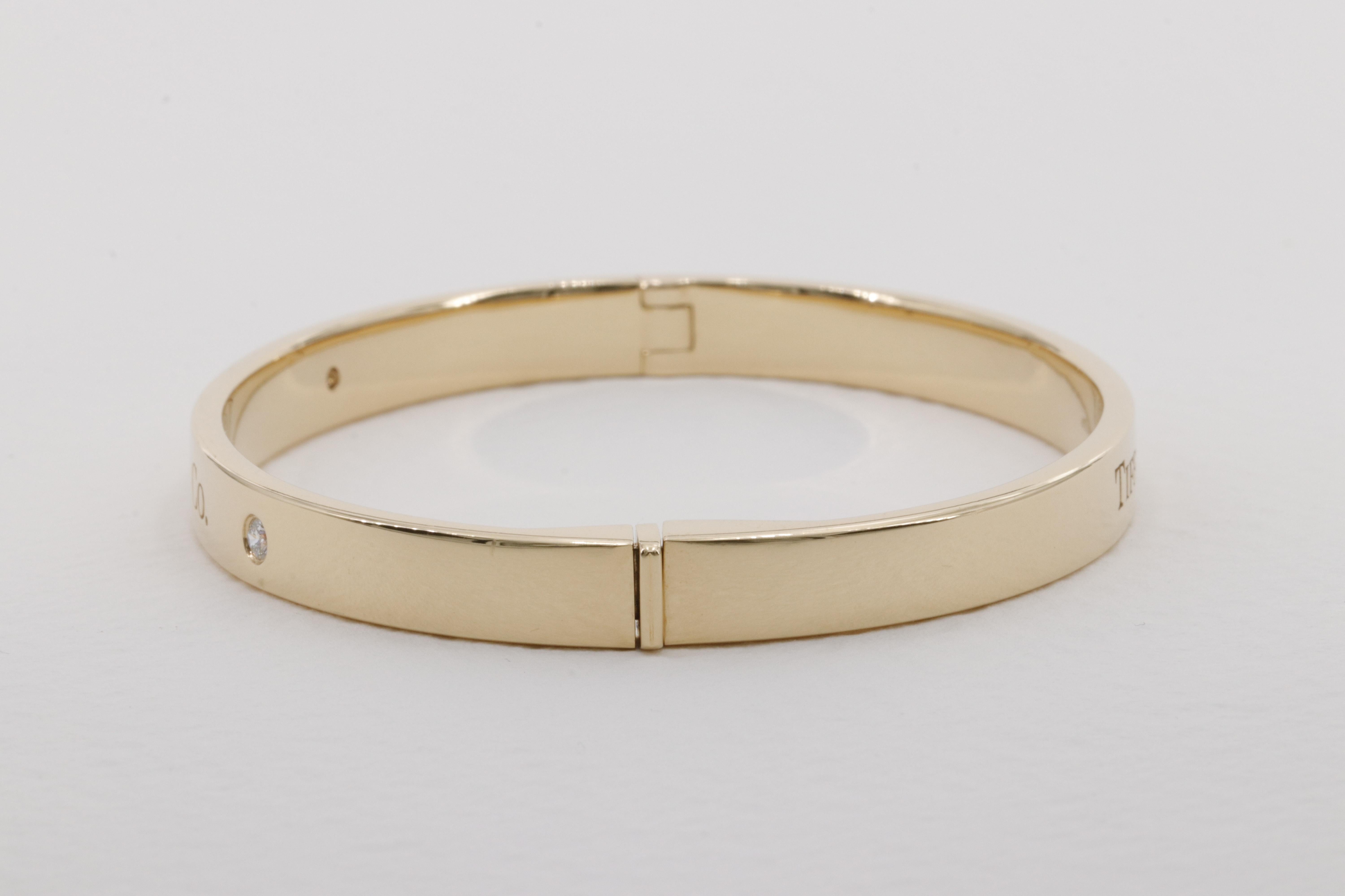 Tiffany & Co. Diamond Hinged Bangle in 18 Karat Yellow Gold  In Excellent Condition For Sale In Tampa, FL