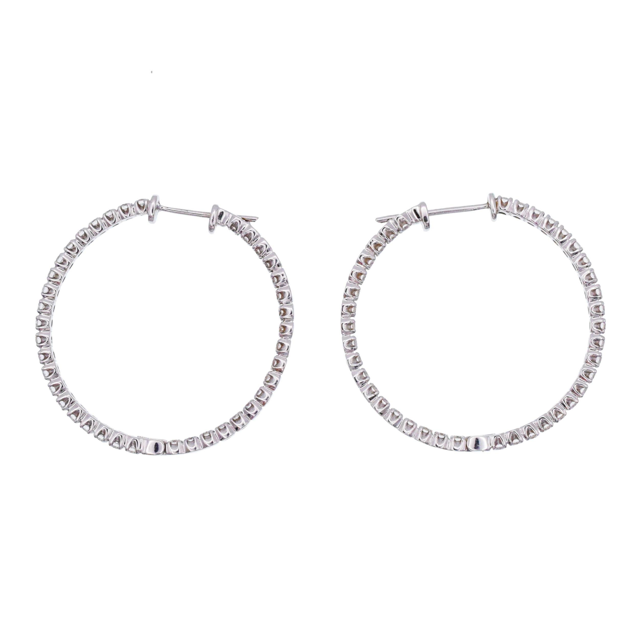 Tiffany & Co. Diamond Inside out Hoop Earrings. These hoop earrings are in & out 4  prong set with total of 78 round brilliant cut diamonds with total weight of approximately 3.00ct, color F-G, clarity VS. Equipped with a posts. Hinged at the