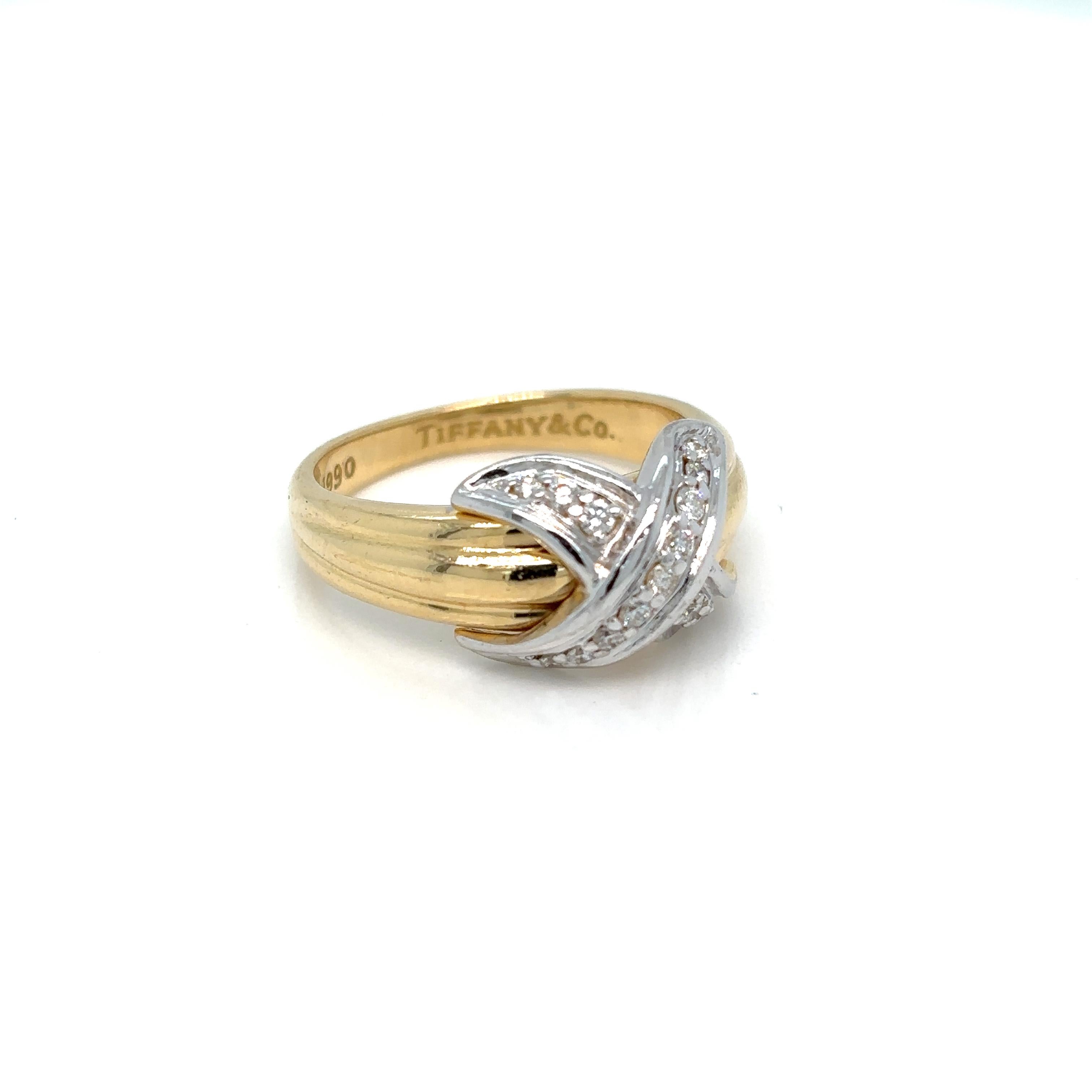 Iconic vintage TIFFANY & Co. 18K Gold and Platinum Diamond Signature X Ring

Metal: 18K Yellow Gold and Platinum (X)
Size: 6,5 - 53, resizable on request
Weight: 6.60 grams
Diamond: round brilliant diamonds, carat total weight .20
Hallmark: 750