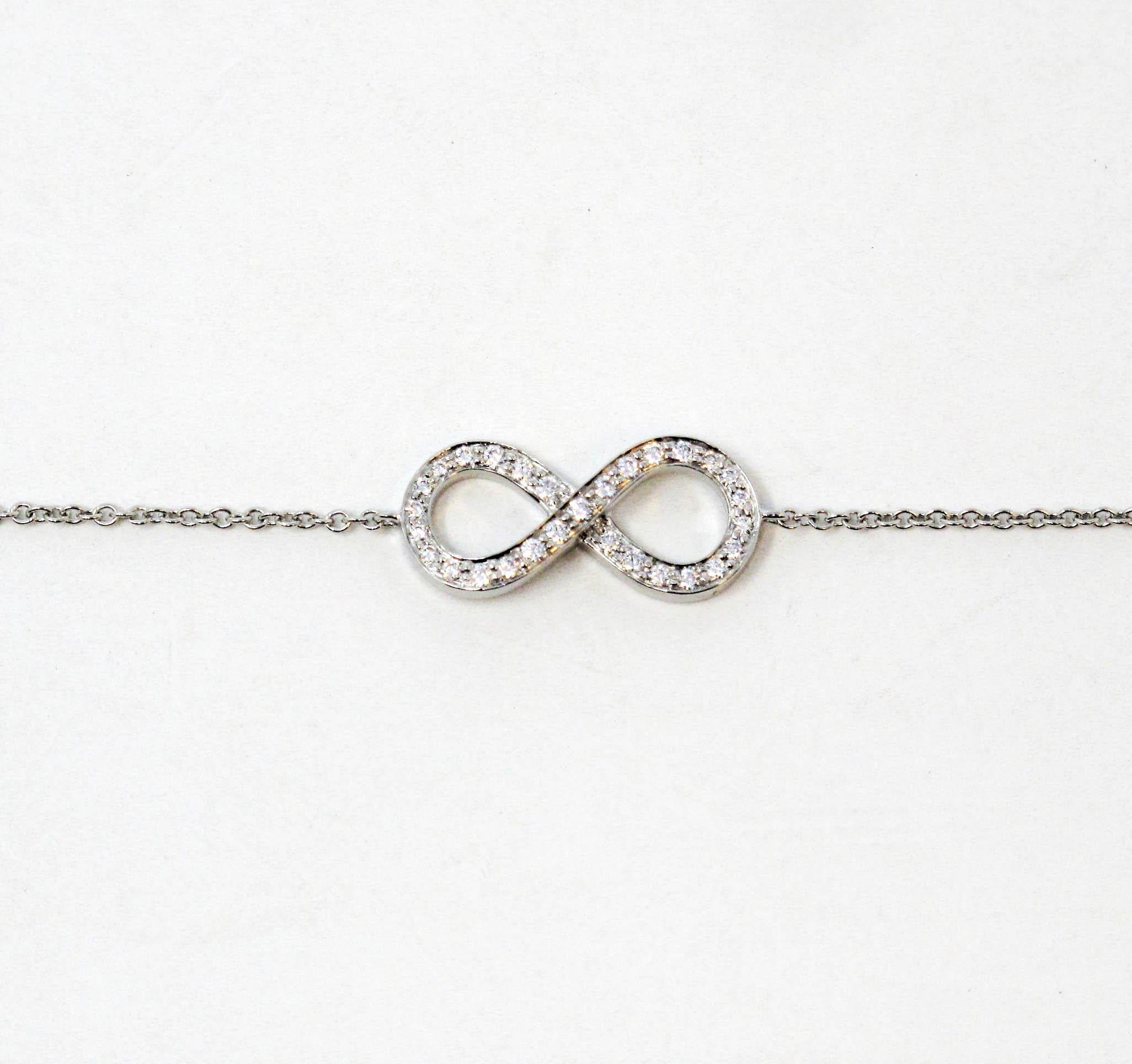 This lovely and delicate Tiffany Infinity chain bracelet will stand the test of time. The timeless infinity symbol is embellished with glittering Tiffany diamonds, while the finely woven platinum chain gently wraps the wrist. This keepsake is truly
