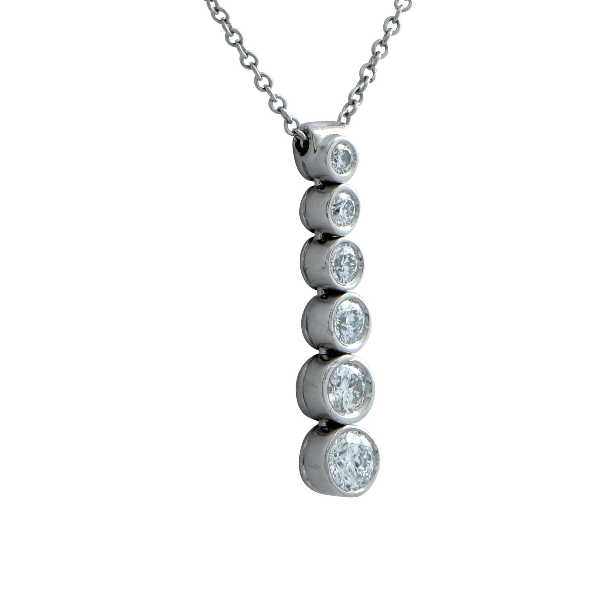 Tiffany and Co. platinum drop necklace from the jazz collection featuring 6 graduating round brilliant cut diamonds weighing approximately .45ct total, F color VS clarity. The necklace has a 16-inch chain and the pendant measures .9 inches in