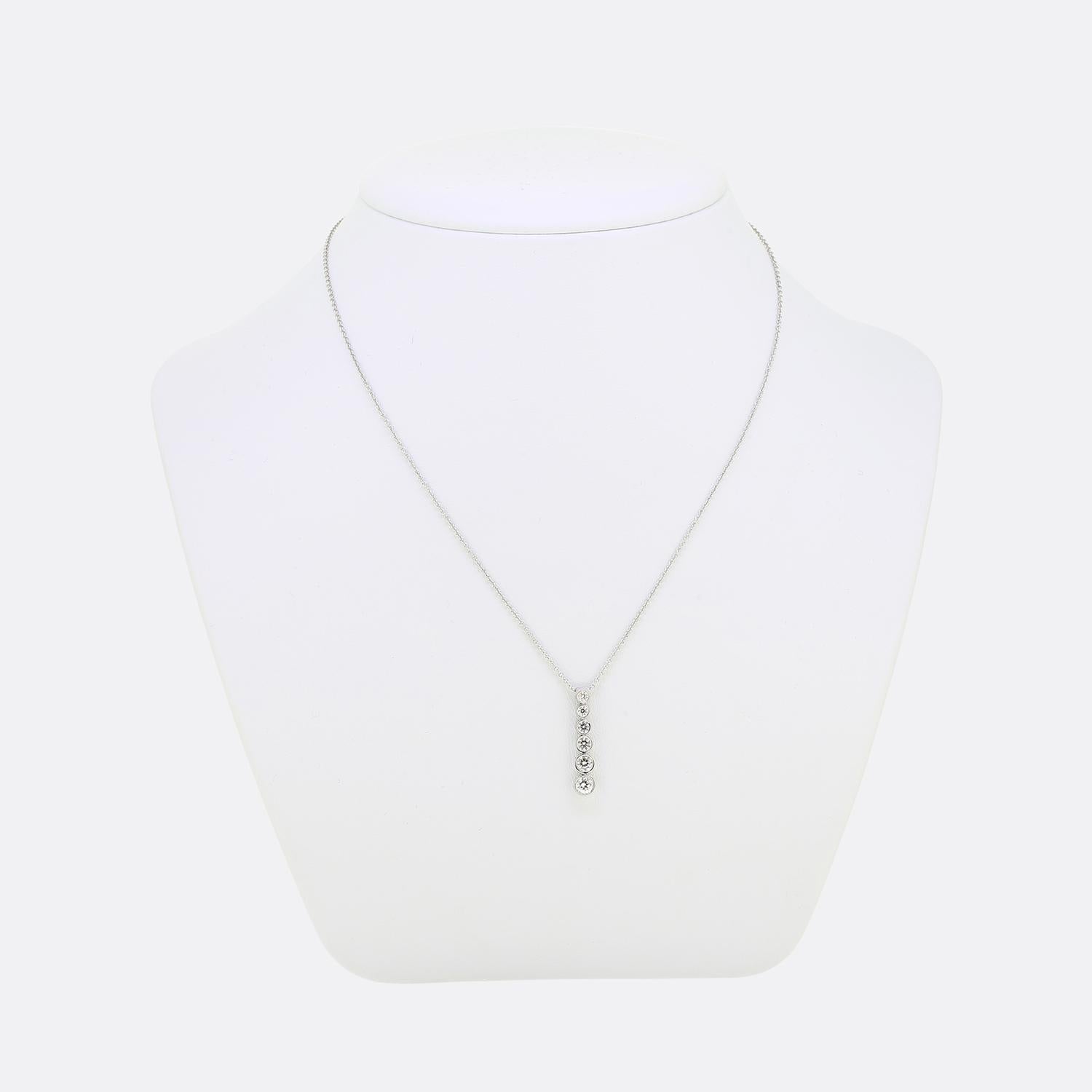 Here we have a wonderful diamond pendant from the world renowned jewellery designer, Tiffany & Co. This piece forms part of their 'Jazz' collection, has been crafted from platinum and showcases six individually rub-over set round brilliant cut