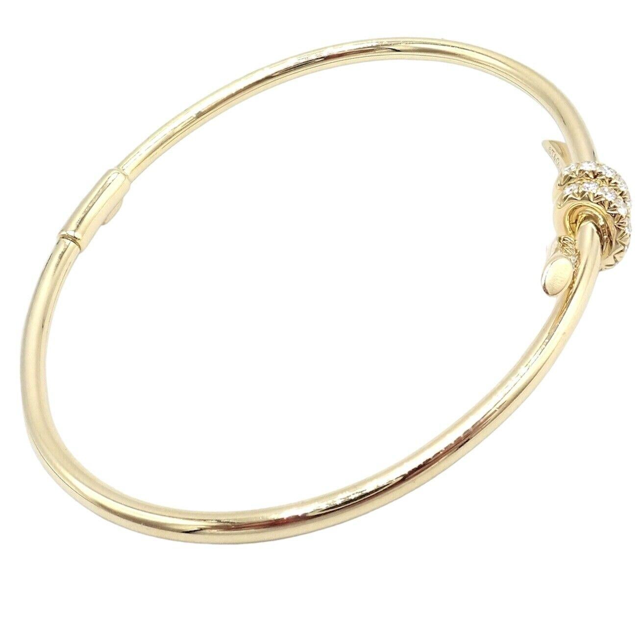 18k Yellow Gold Diamond Knot Bangle Bracelet by Tiffany & Co. 
With 28 Round Brilliant Cut Diamonds VS1 clarity, G color total weight approximately 0.34ct
Details: 
Weight: 9.3 grams
Length: 6.25