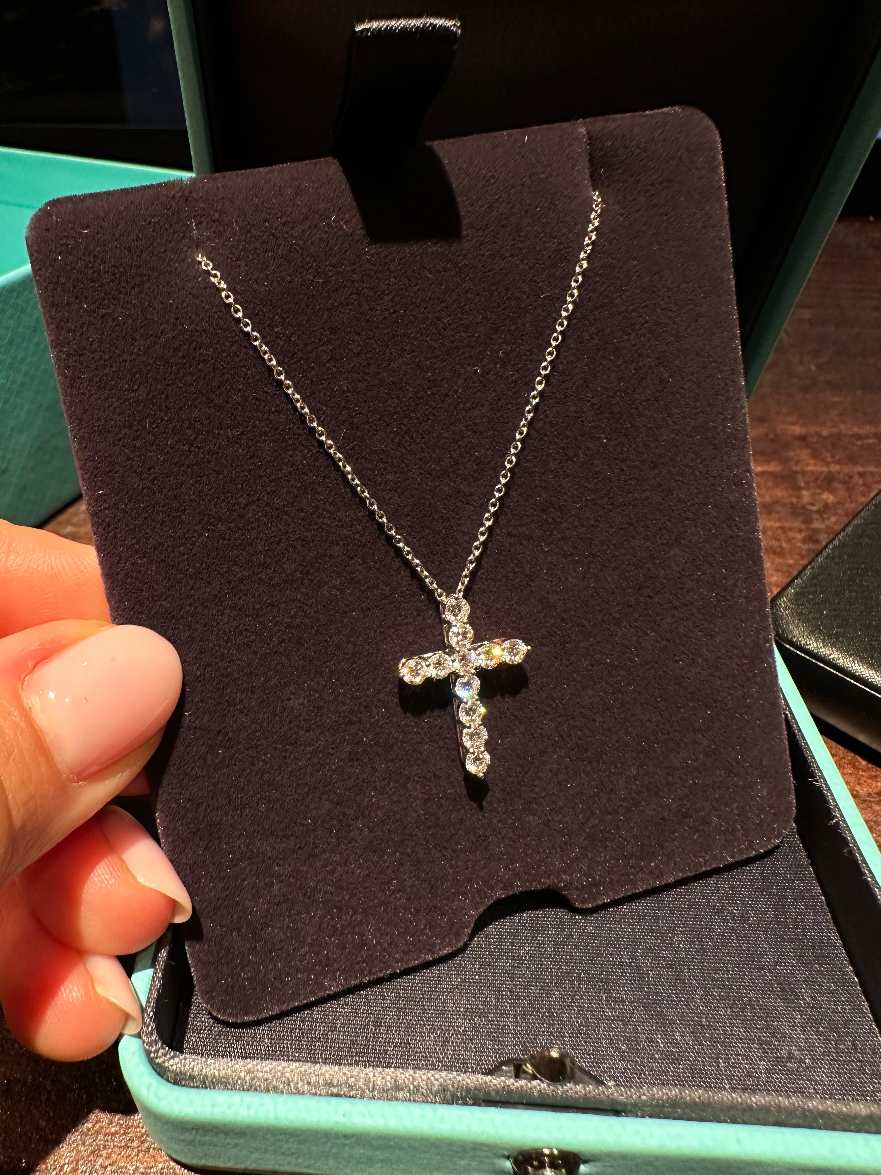 This beautiful platinum Tiffany & Co. necklace features a stunning diamond Tiffany & Co. cross with approximately 2.00CTW of diamonds.

Diamond Carat Weight: Over 1.71 CTW
Diamond Cut: Round Brilliant
Color: Average D-E
Clarity: Average