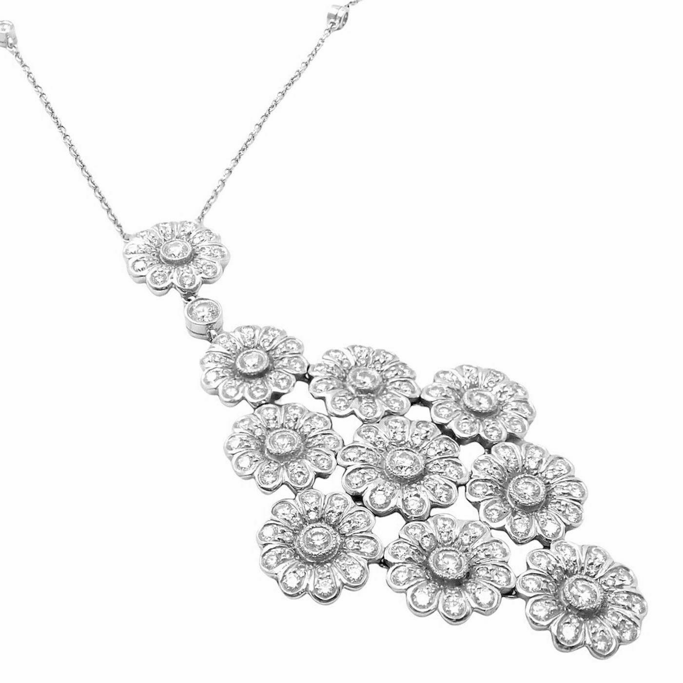 Platinum Diamond Large Daisy Flower Pendant Necklace by Tiffany & Co. 
With 117 Round brilliant cut diamonds VS1 clarity, G color total weight approx. 1.25ctw
Details: 
Weight: 18 grams
Length: 16.75