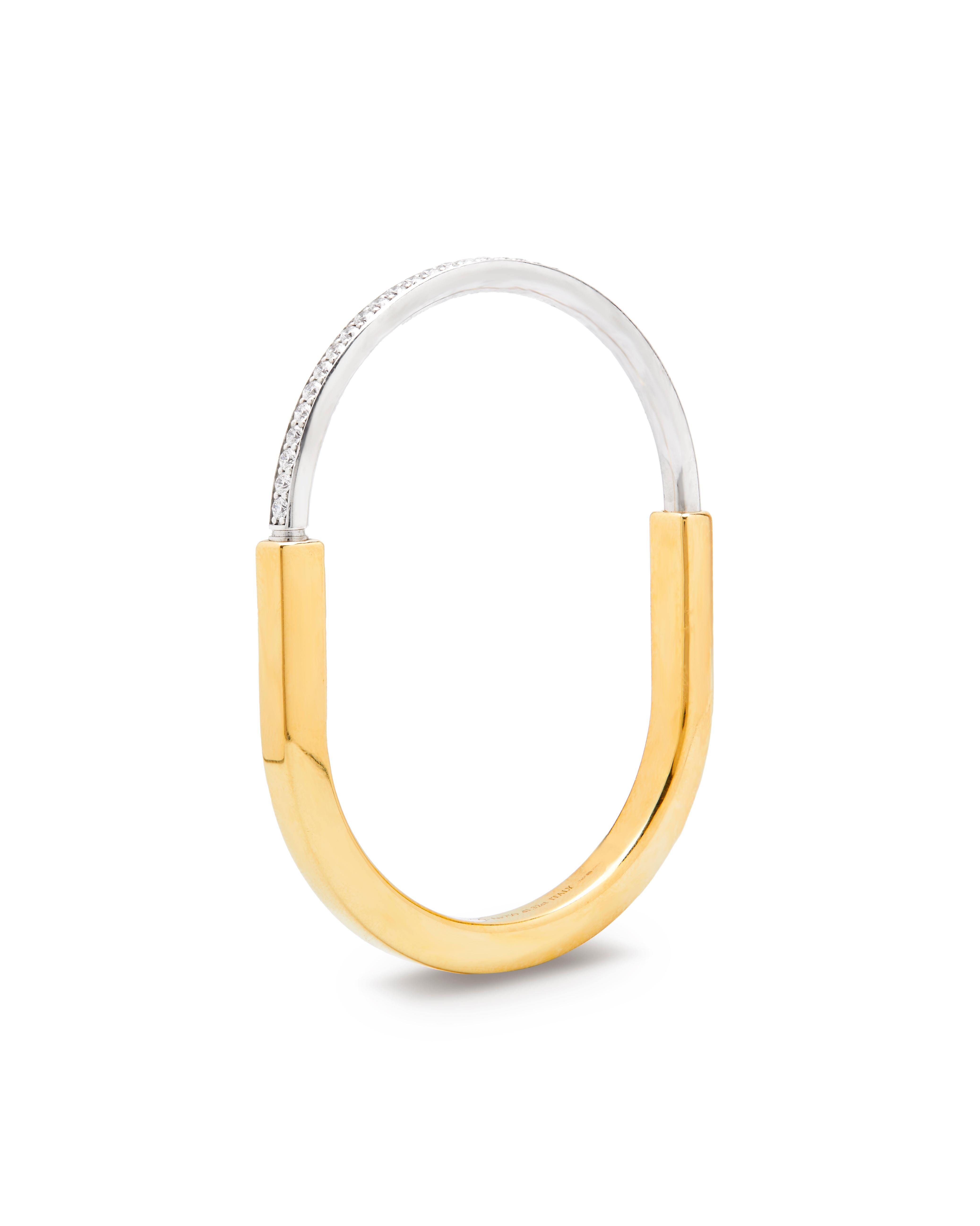 Tiffany & Co Iconic lock bracelet 

An expression of enduring Love, this modern and sleek design has become one of Tiffany’s must have pieces. 

This can be worn stacked and styled with a Cartier Love or perhaps a Clash? 

Crafted in 18ct yellow &
