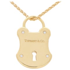 Tiffany & Co. Diamond Lock Pendant Set in Solid 18 Karat Yellow Gold