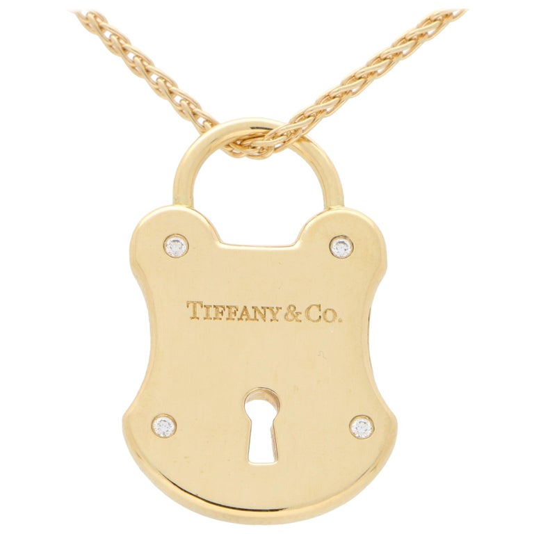 Tiffany and Co. Diamond Lock Pendant Set in Solid 18 Karat Yellow