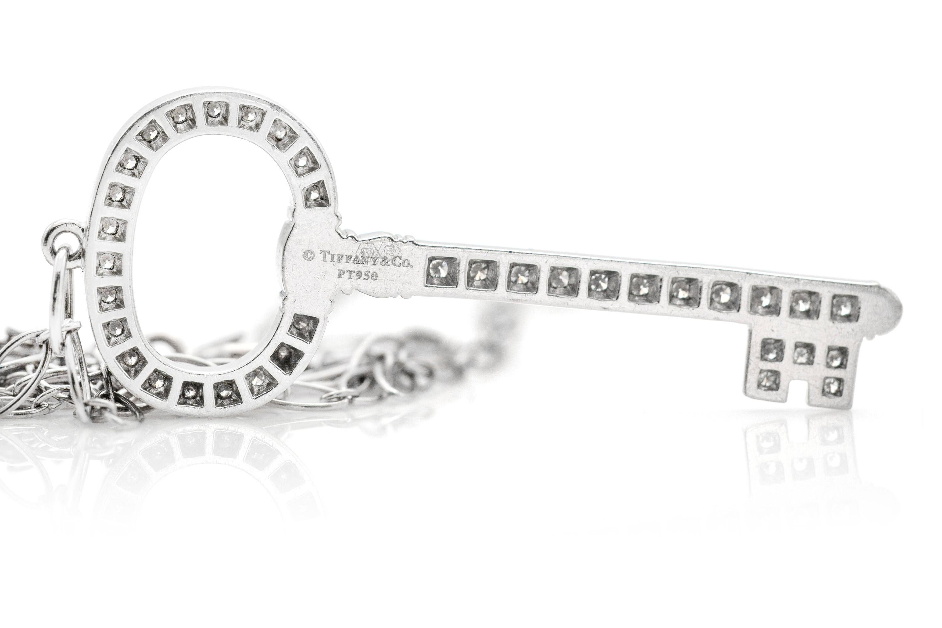 Finely crafted in platinum with diamonds covering the entire key, with original chain. Signed Tiffany & Co. 
