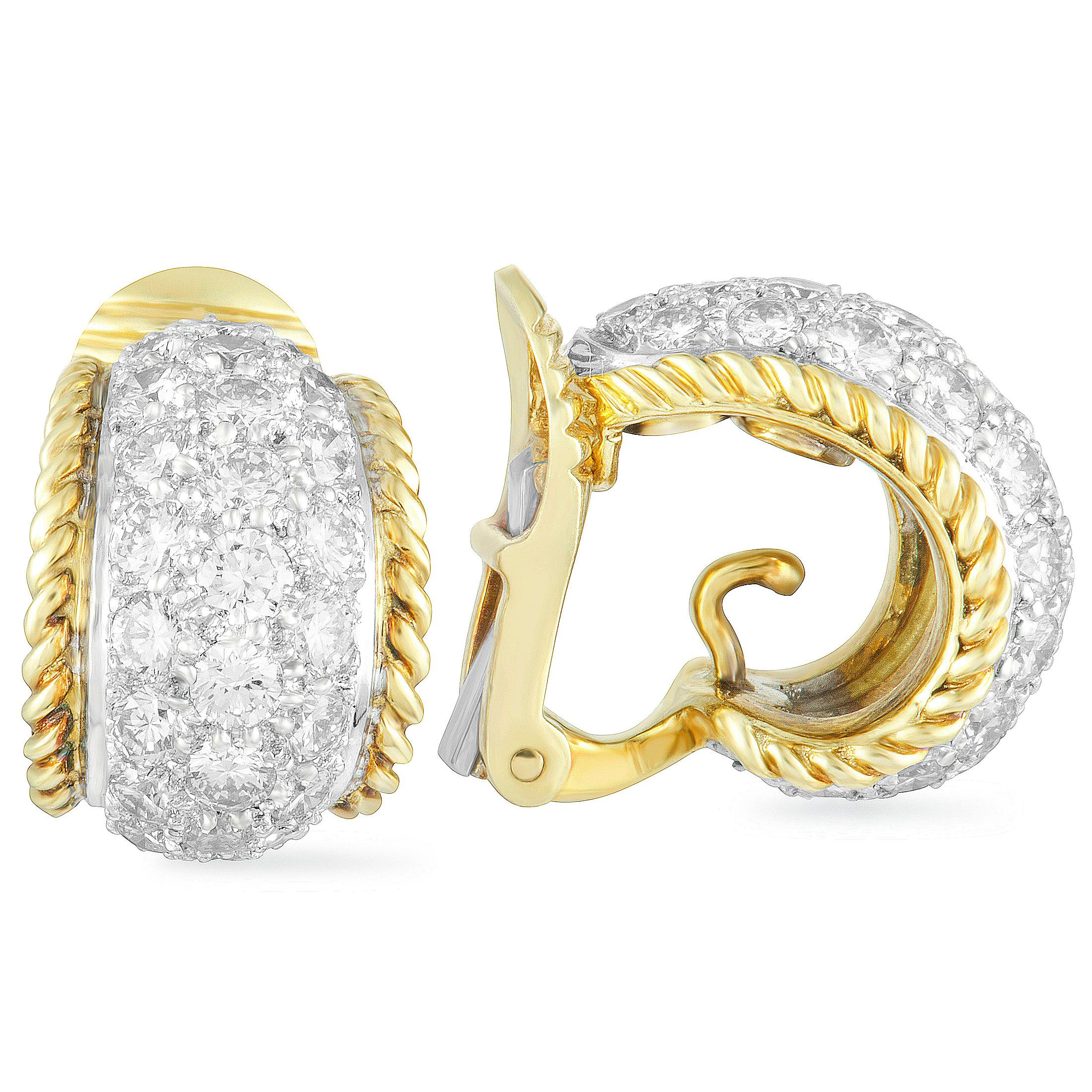 Exquisitely crafted from platinum and 18K yellow gold and embellished in a most luxurious manner, these stunning earrings designed by Tiffany & Co. offer an exceptionally prestigious appearance. The pair is decorated with colorless (grade F) diamond