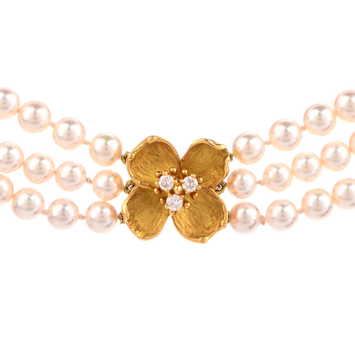 This stunning designer Tiffany & Co. necklace is crafted with 18-karat yellow gold, weighing 56.8 grams and measuring 16” long x 15mm wide. Composed of three strands of high lustrous Akoya Jappanies pearls, measuring 4.5mm- 5mm in diameter.