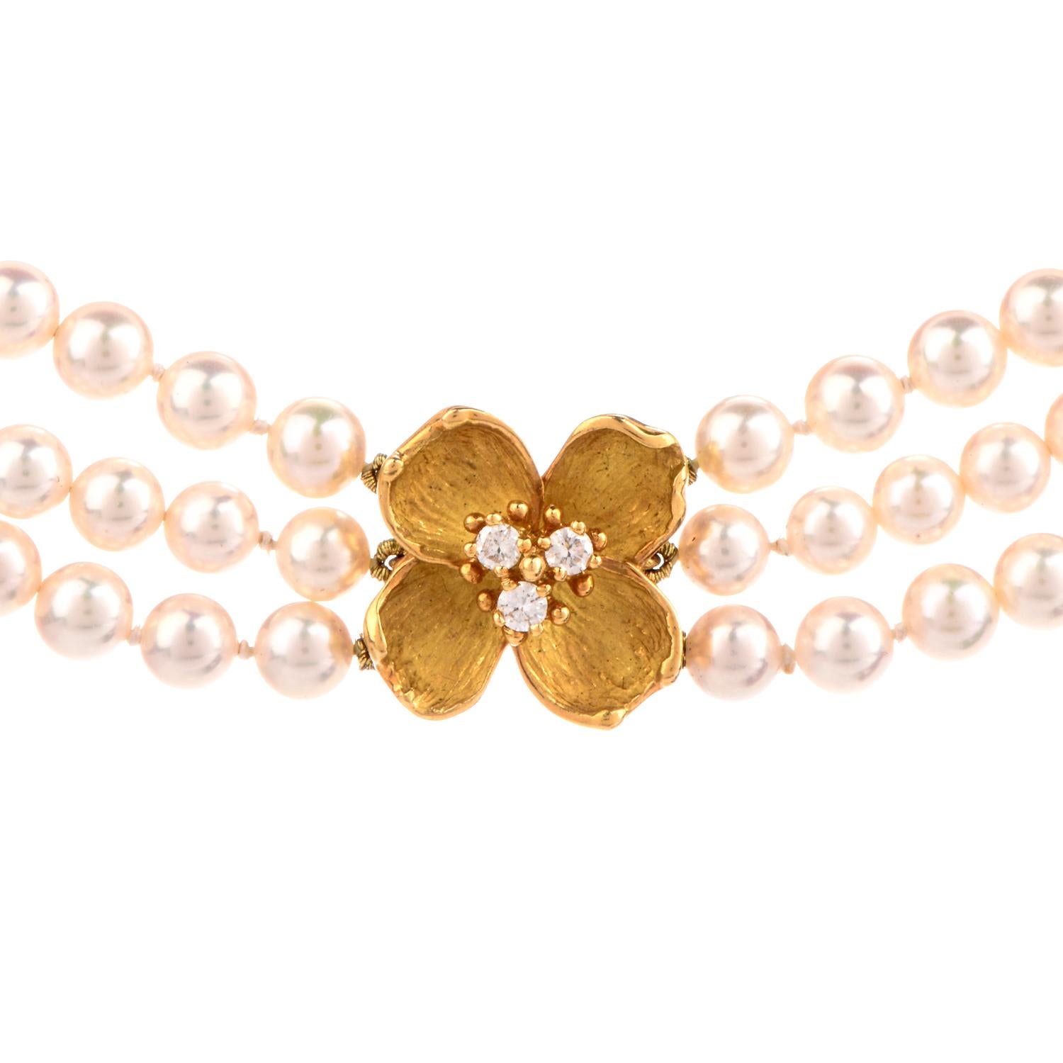 This stunning designer Tiffany & Co. necklace is crafted with 18-karat yellow gold, weighing 56.8 grams and measuring 16” long x 15mm wide. Composed of three strands of high lustrous Akoya Jappanies pearls, measuring 4.5mm- 5mm in diameter.