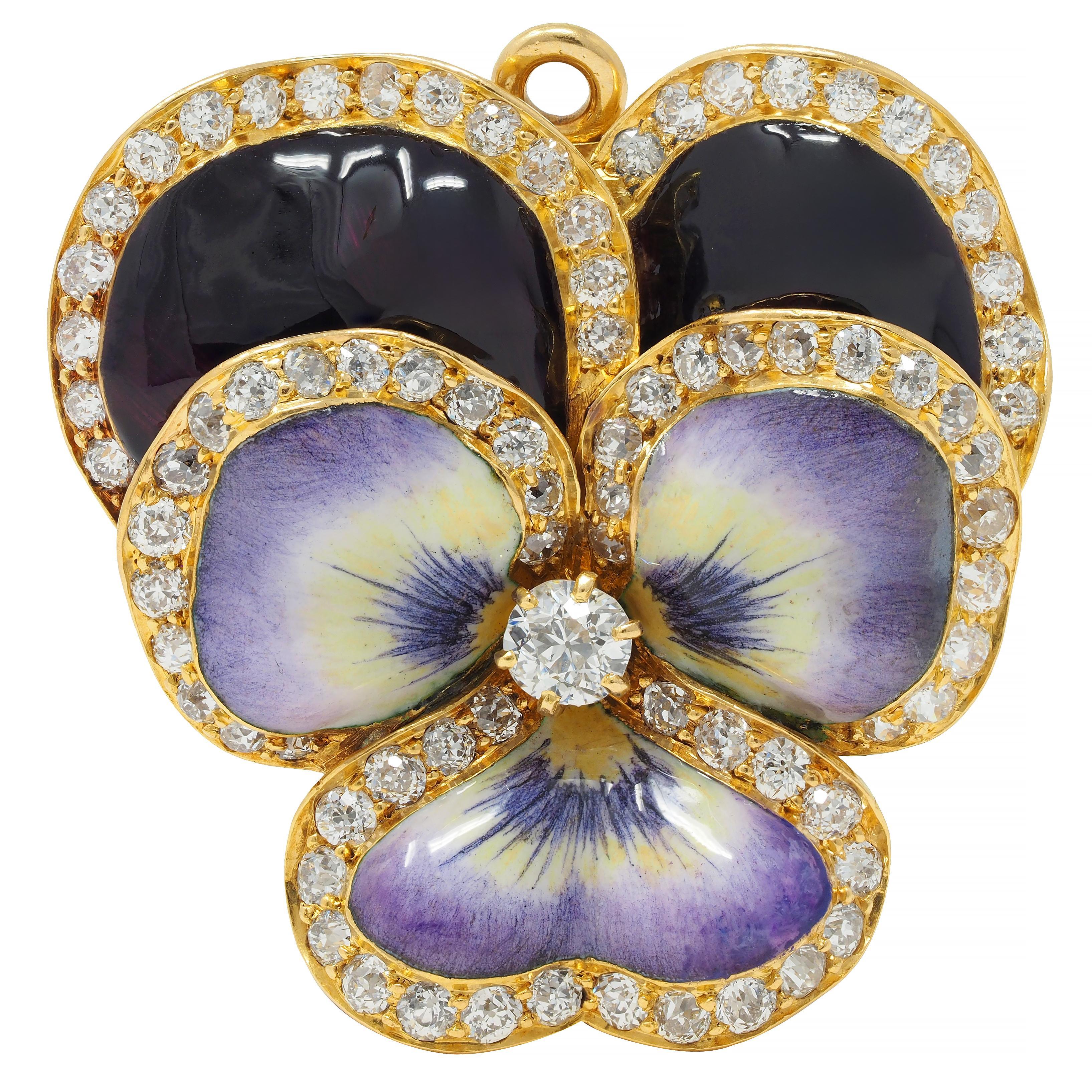 Pendant brooch is designed as a pansy flower with delicately painted dimensional enamel petals
Glossy opaque purple, maroon, white, and yellow - exhibiting minimal loss
With old European cut diamonds bead set along petal edges throughout
Centering