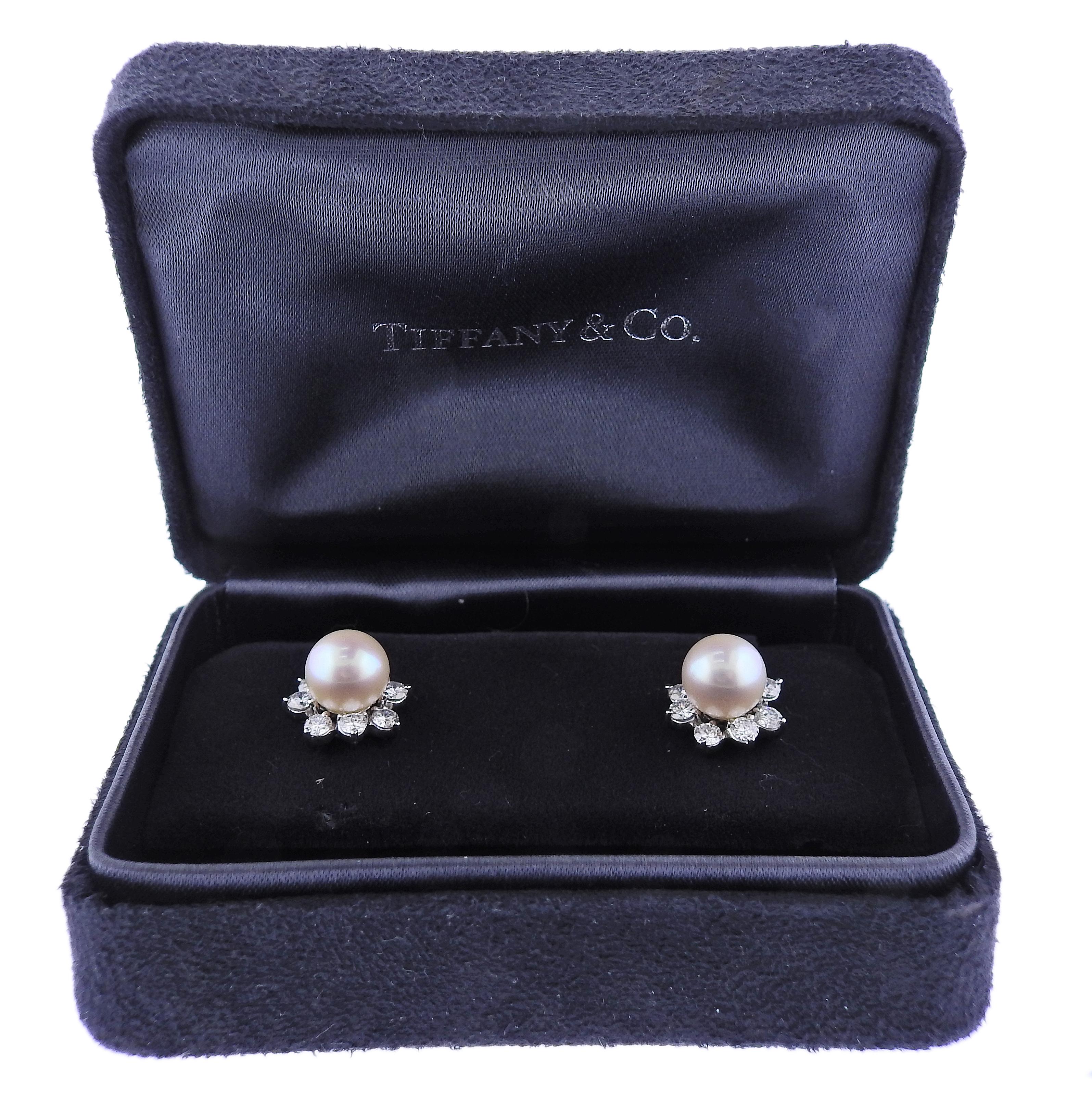 Pair of platinum night & day earrings by Tiffany & Co, featuring removable diamond enhancers. Pearls are 8.2mm in diameter. Diamond jackets are 13mm in diameter. Come in T & Co box. Marked: 112, T & Co, Plat.  Diamonds approx. 1.12ctw G/VS. Weight -