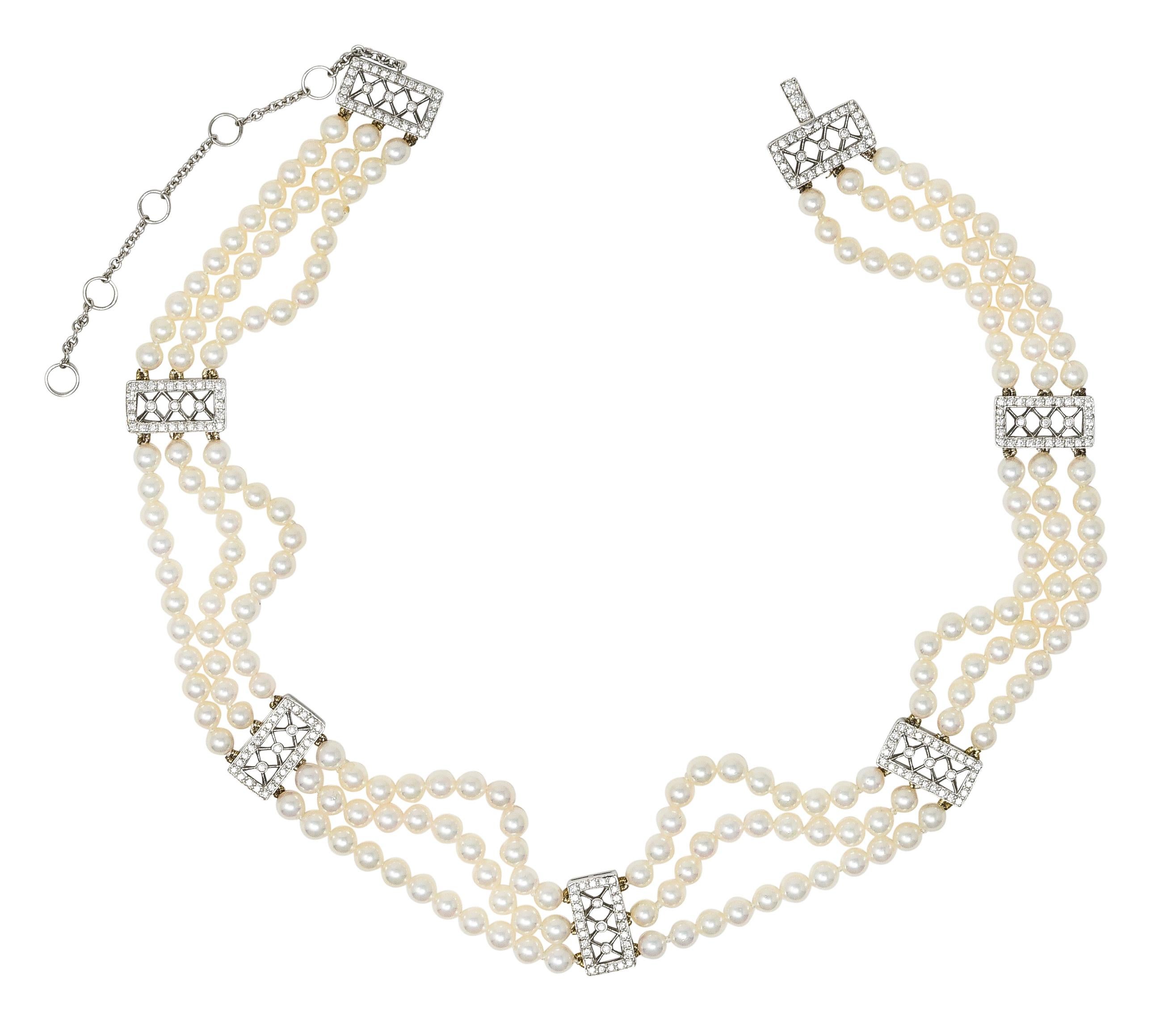 Designed as three strands of 3.5 to 4.0 mm round pearls graduating in size. Opaque white in body color with moderate iridescence and great luster. Bisected by seven rectangular lattice motif platinum stations. With bead and bezel set round brilliant