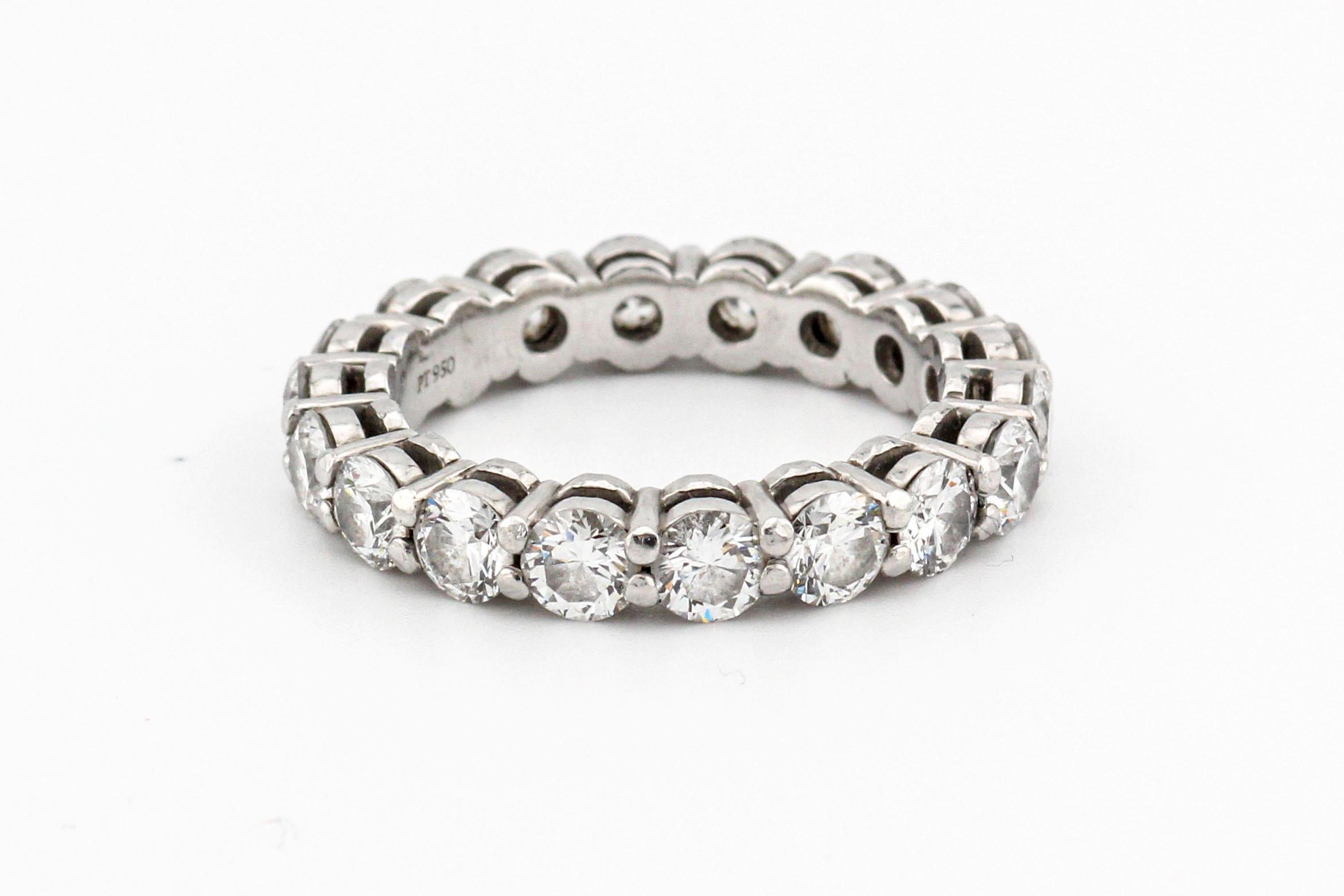 The Tiffany & Co. Diamond Platinum 3.7mm Shared Setting Band is a magnificent piece of jewelry that embodies timeless elegance and exquisite craftsmanship. Crafted by one of the world's most renowned luxury jewelry brands, this ring is a true symbol
