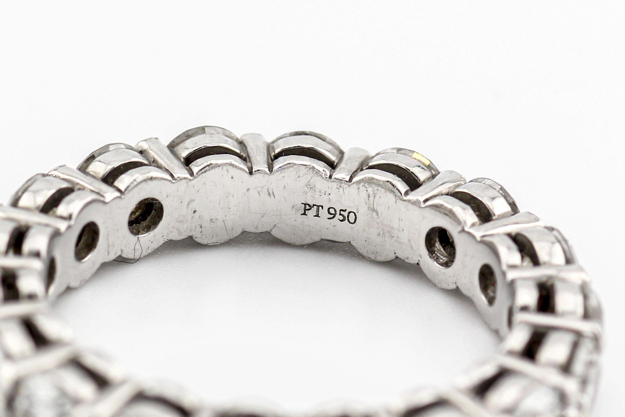 The Tiffany & Co. Diamond Platinum 3.7mm Shared Setting Band is a magnificent piece of jewelry that embodies timeless elegance and exquisite craftsmanship. Crafted by one of the world's most renowned luxury jewelry brands, this ring is a true symbol