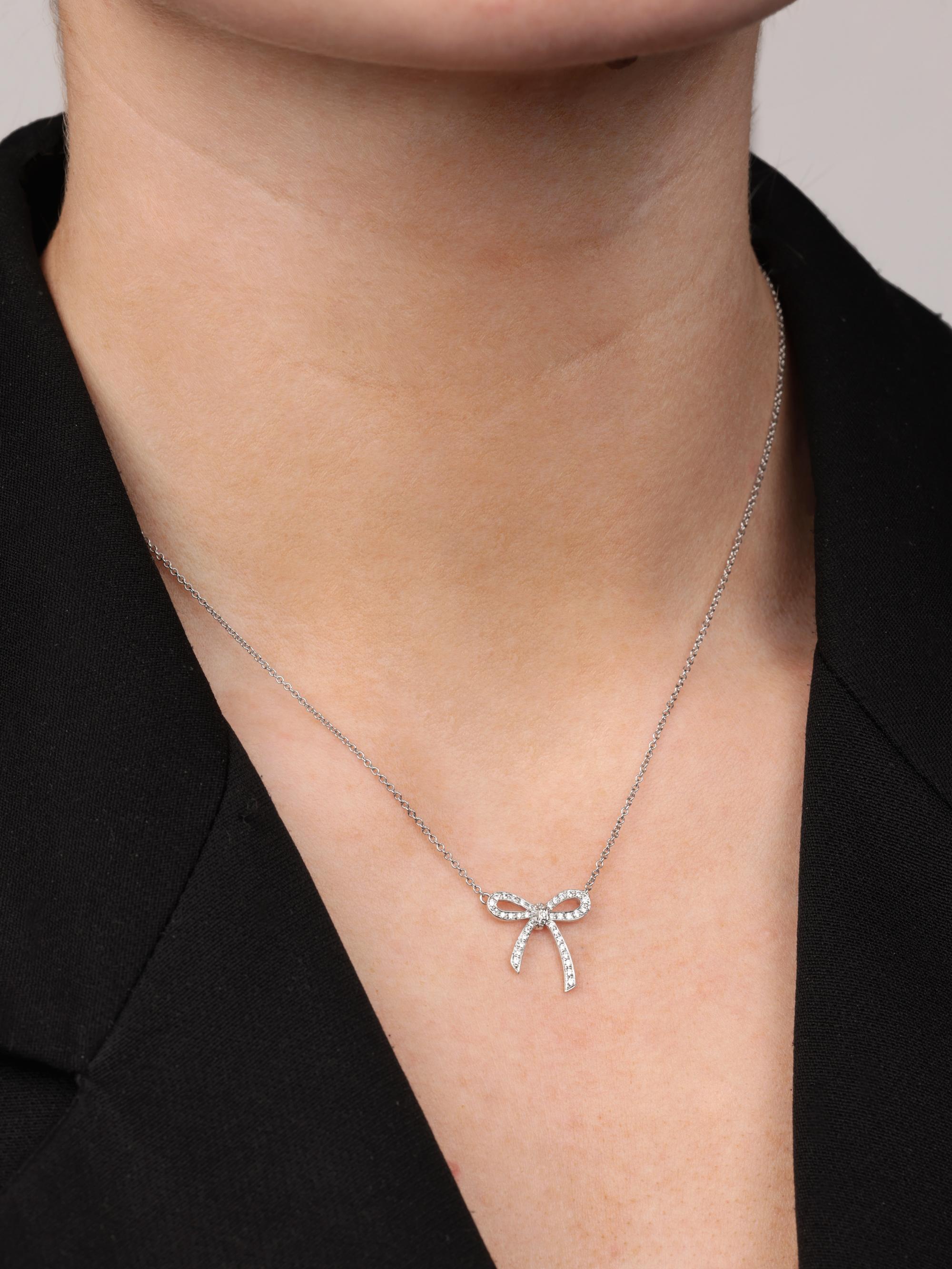 Tiffany & Co. Diamond Platinum Bow Necklace

Product Details
Xupes Ref: J1483
Brand: Tiffany & Co.
Model: Bow Necklace
Type: Necklace
Accompanied By: Tiffany & Co. Box
Material(s): Platinum
Gemstone: Diamond

Specification
Gemstone Cut: Round