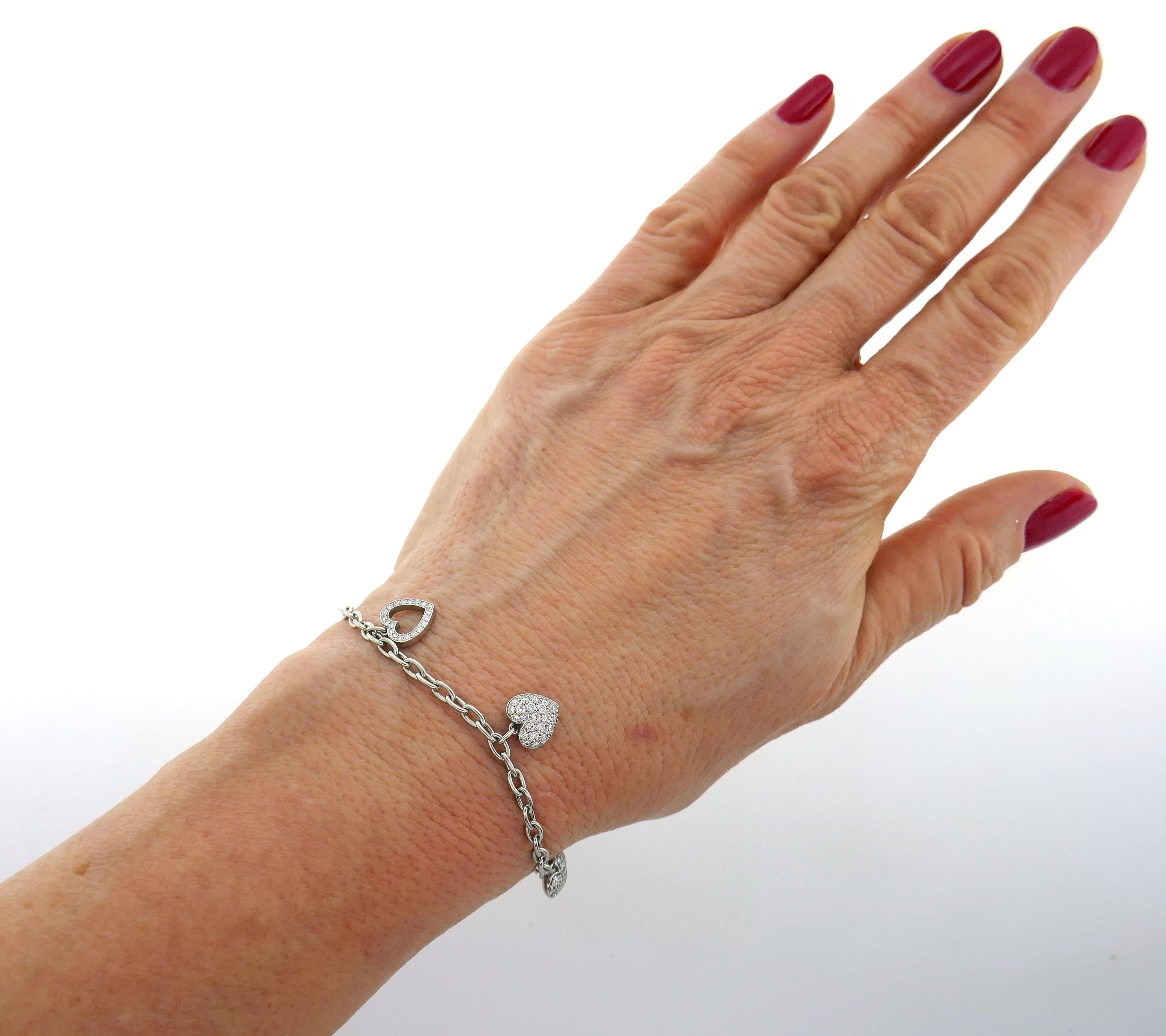 Lovely and cute charm bracelet created by Tiffany & Co. in France in 2003. Tiffany doesn't make it anymore. Feminine, delicate and wearable, the bracelet is a great addition to your jewelry collection and perfect gift, especially for Valentine's