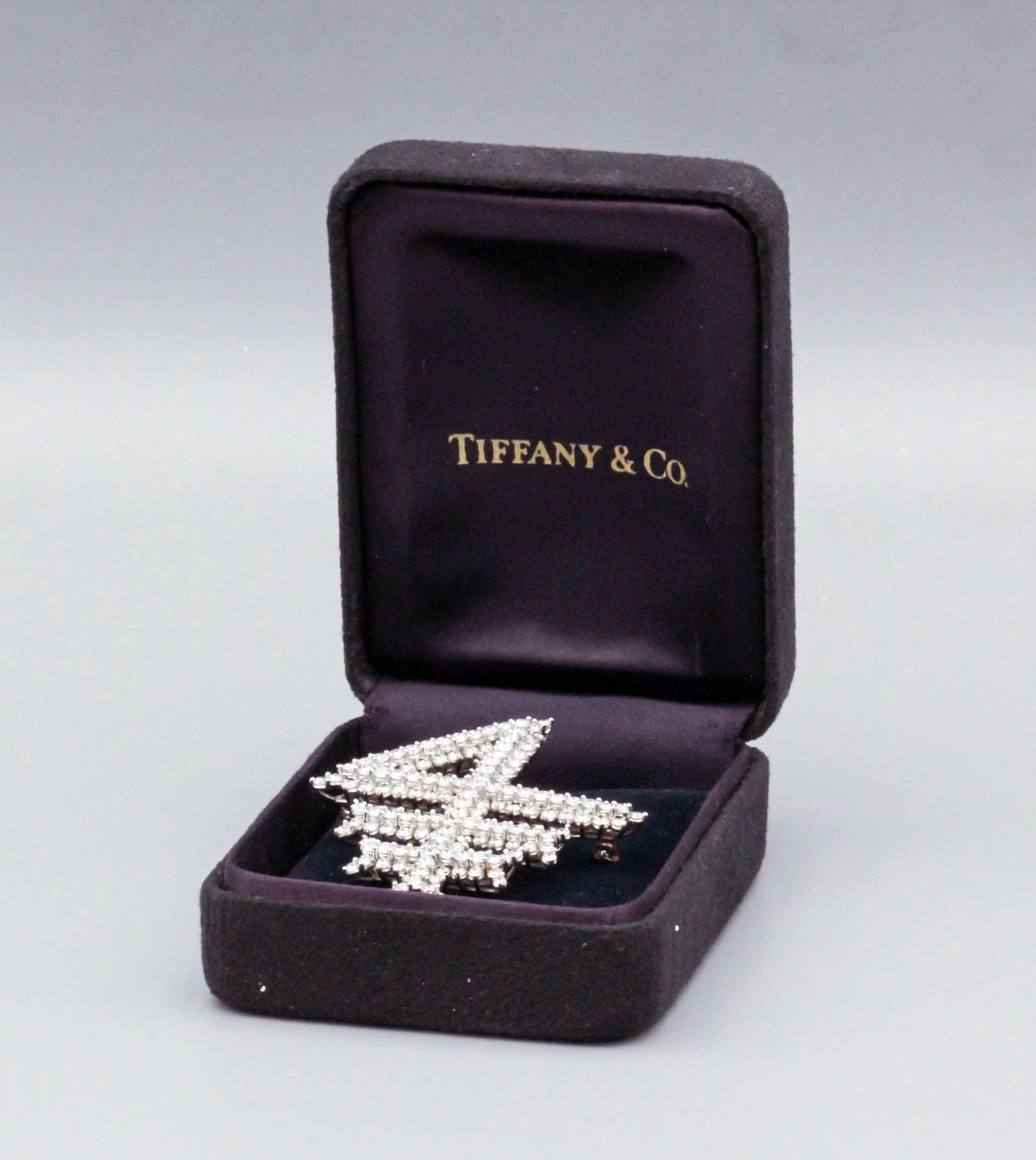 For your consideration, a fine a rare Tiffany & Co. diamond and platinum brooch made in the likeness of the Columbia Business School logo.  Quite possibly a unique piece. 

This fine diamond and platinum Tiffany & Co. brooch, circa 1990s, is a
