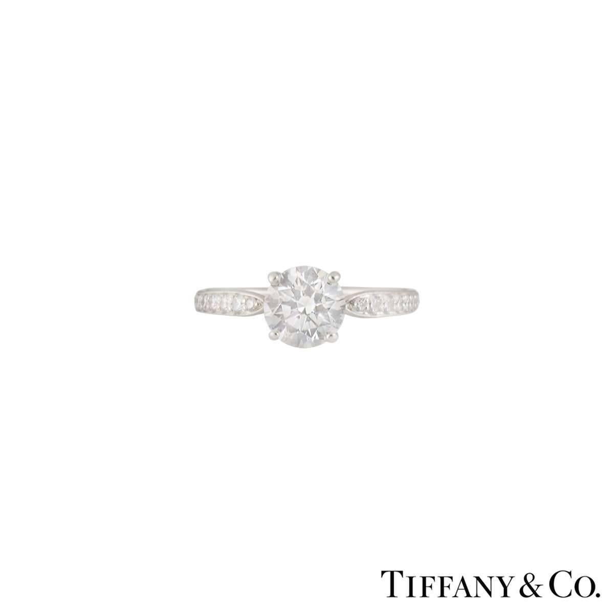 A beautiful platinum diamond Tiffany & Co. engagement ring from the Harmony collection. The ring comprises of a round brilliant cut diamond set to the centre in a 4 claw setting with a weight of 1.05ct, G colour and VS2 clarity. The diamond scores