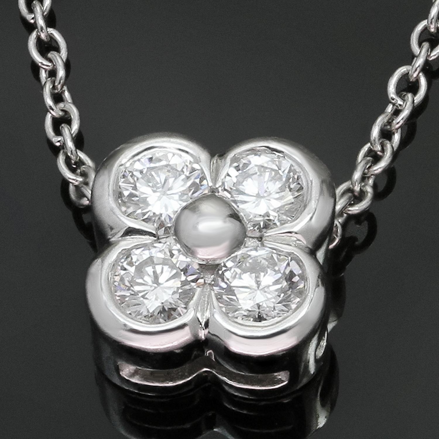 This classic and timeless Tiffany & Co. necklace crafted in platinum and features a flower-shaped pendant bezel-set with brilliant-cut round F-G VVS1-VVS2 diamonds of an estimated 0.24 carats. Made in United States circa 2000s. Measurements: 0.31