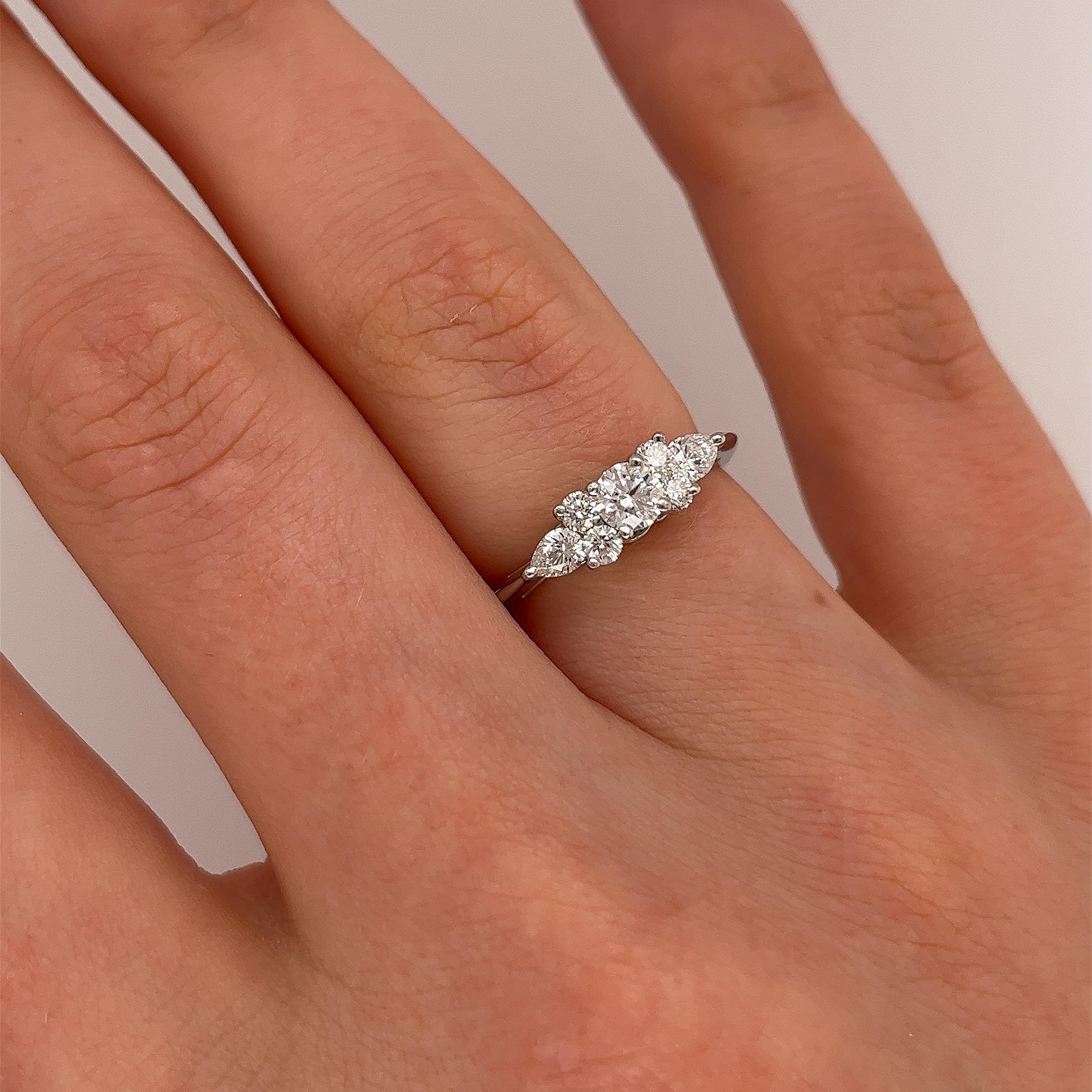 Tiffany & Co. Diamond Platinum Seven Stone Ring is a breathtaking piece with a captivating design. 
This ring features seven exquisite diamonds set in platinum, creating a stunning display of brilliance and elegance. The arrangement typically