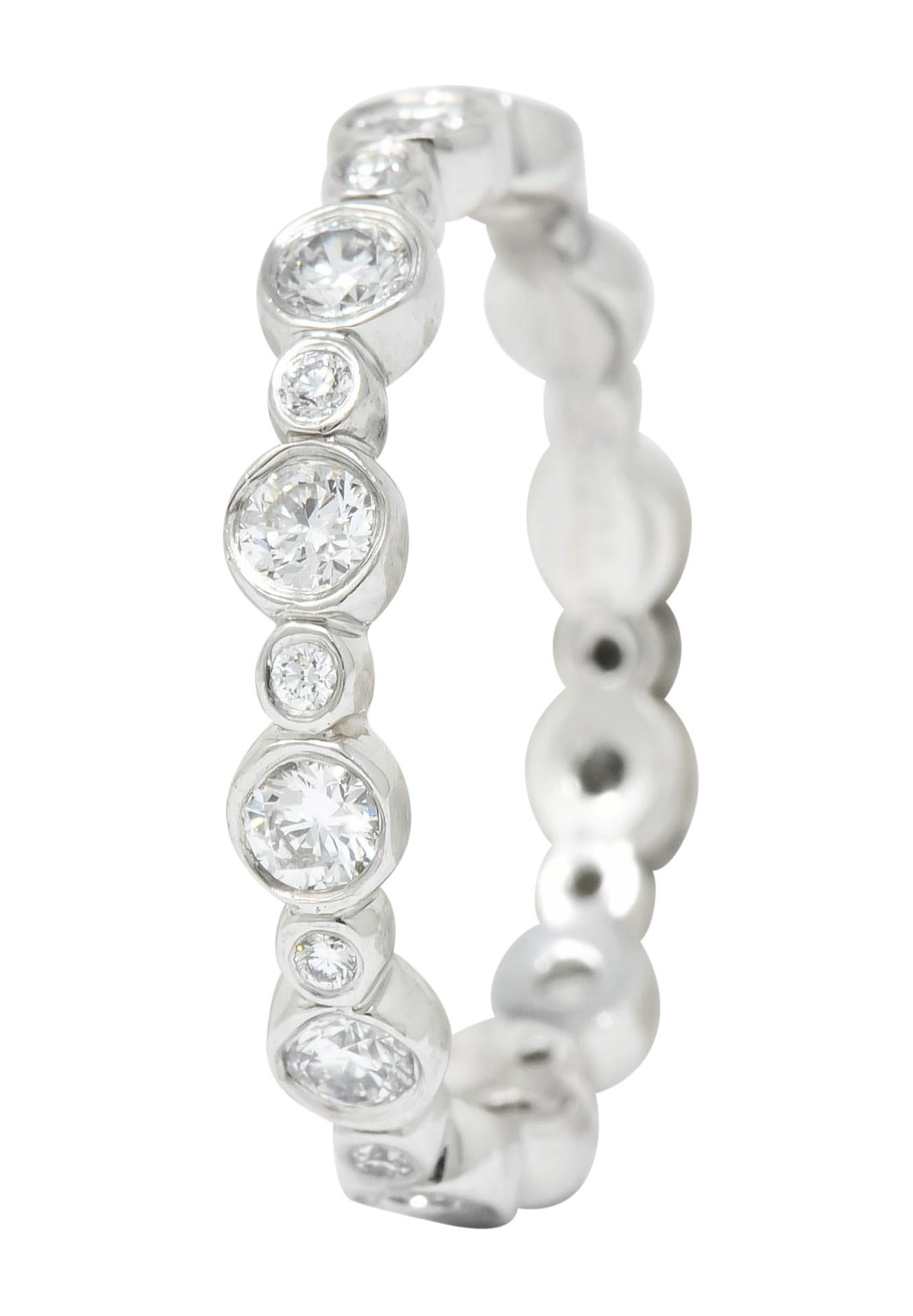 Eternity band ring designed as large circle motif alternating with smaller spacer circles

Each bezel set with a round brilliant cut diamond weighing in total 0.62 carat, F/G color and VVS clarity

From the contemporary Tiffany Jazz