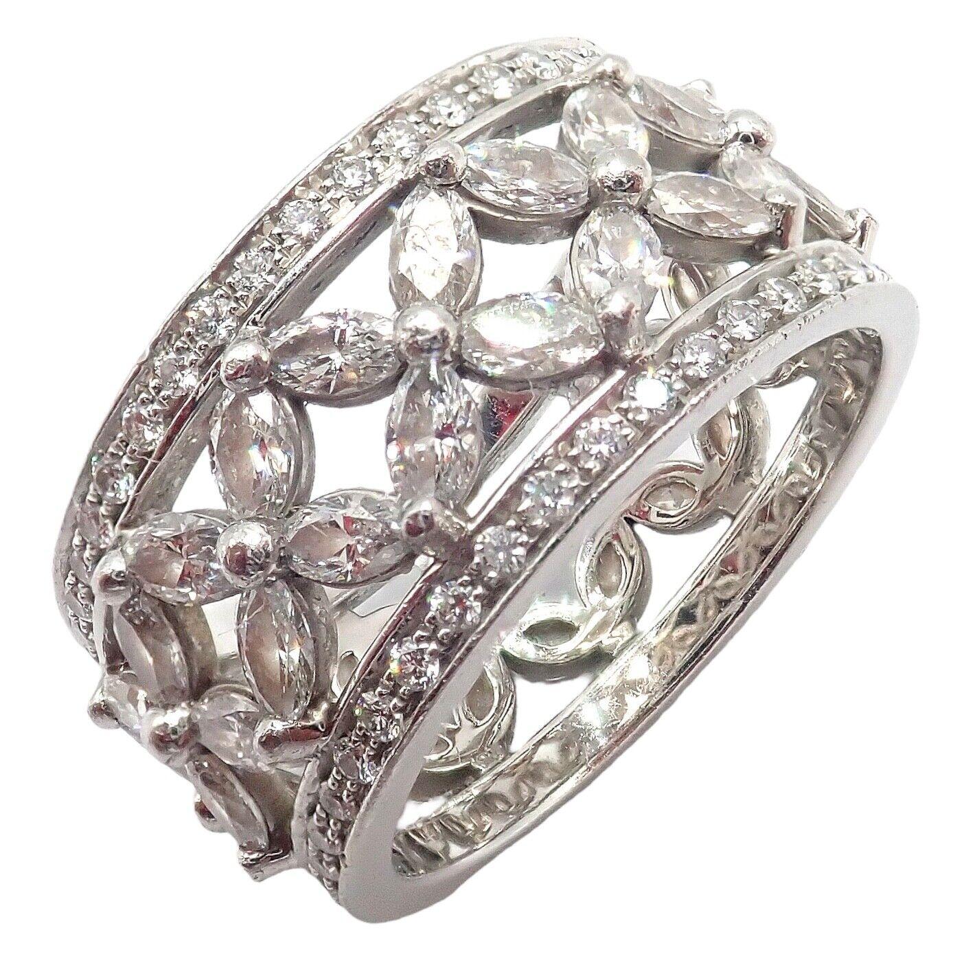 Platinum Victoria Diamond Eternity Wide Band Ring by Tiffany & Co. 
The Tiffany & Co Platinum Victoria Wide Band Ring features a 2.34-carat total weight of diamonds set in a platinum band. 
The ring showcases a floral-inspired design with marquise
