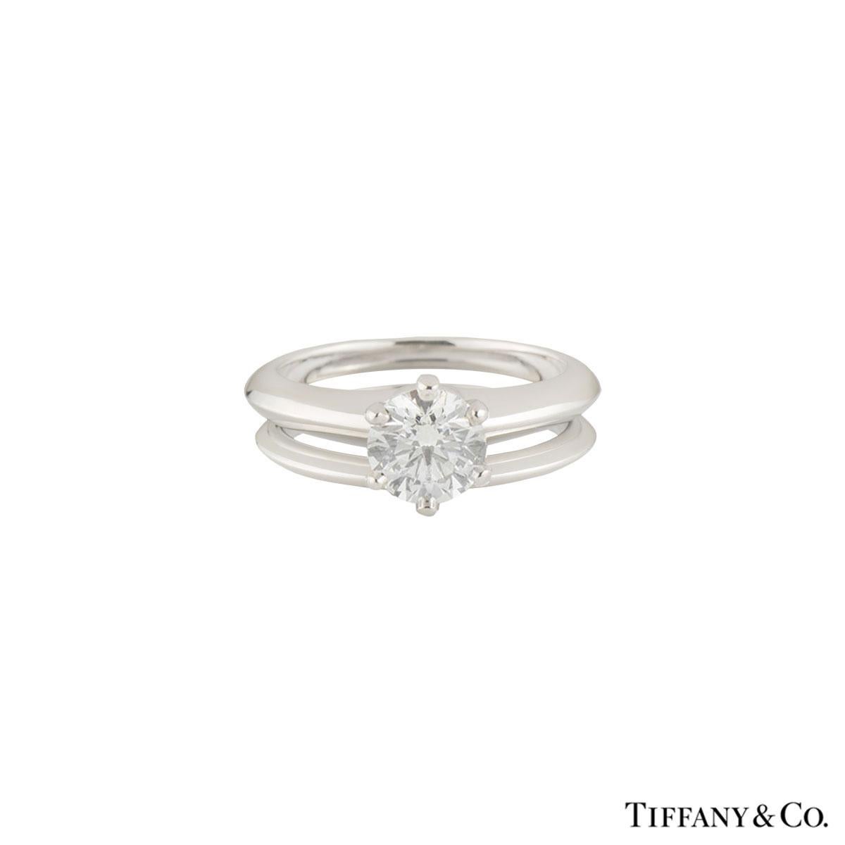 A beautiful platinum Tiffany & Co. diamond engagement ring from the setting collection. The engagement ring comprises of a round brilliant cut diamond in a 6 claw setting with a weight of 2.04ct, E colour and VVS2 clarity. The ring also comes with a
