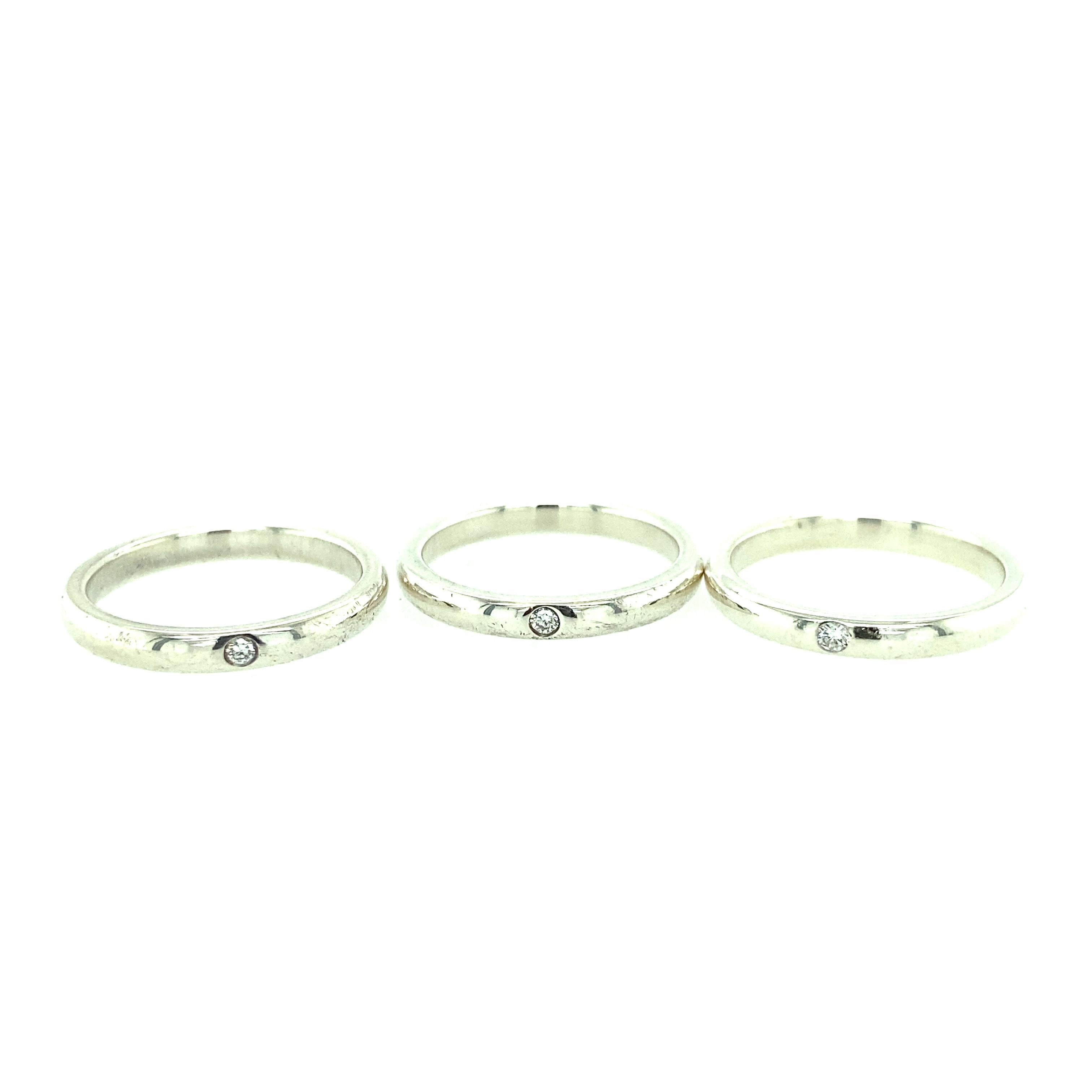 One set of three sterling silver 2.65mm bands each set with one brilliant cut diamond, approximately, 0.10 carat total weight with matching H-I color and SI clarity.  The rings are a finger size 6.5.   