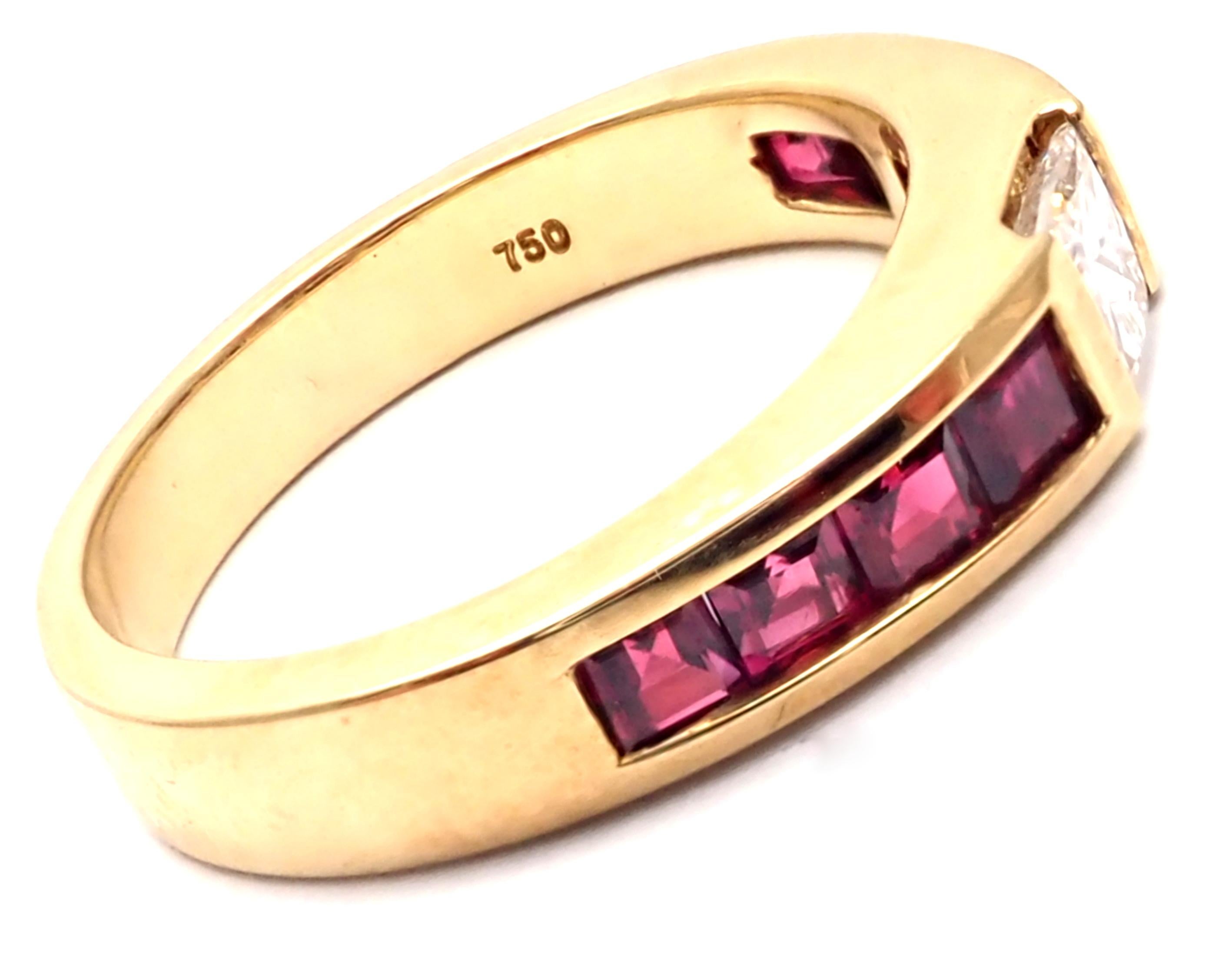 18k Yellow Gold Diamond Ruby Band Ring by Tiffany & Co.
With 1 princess cut diamond VS1 clarity G color total weight approx. .35ct
4 rubies approximately .80ct
Details: 
Ring Size: 4 3/4, can be resized.
Weight: 4 grams
Width: 4mm
Stamped Hallmarks: