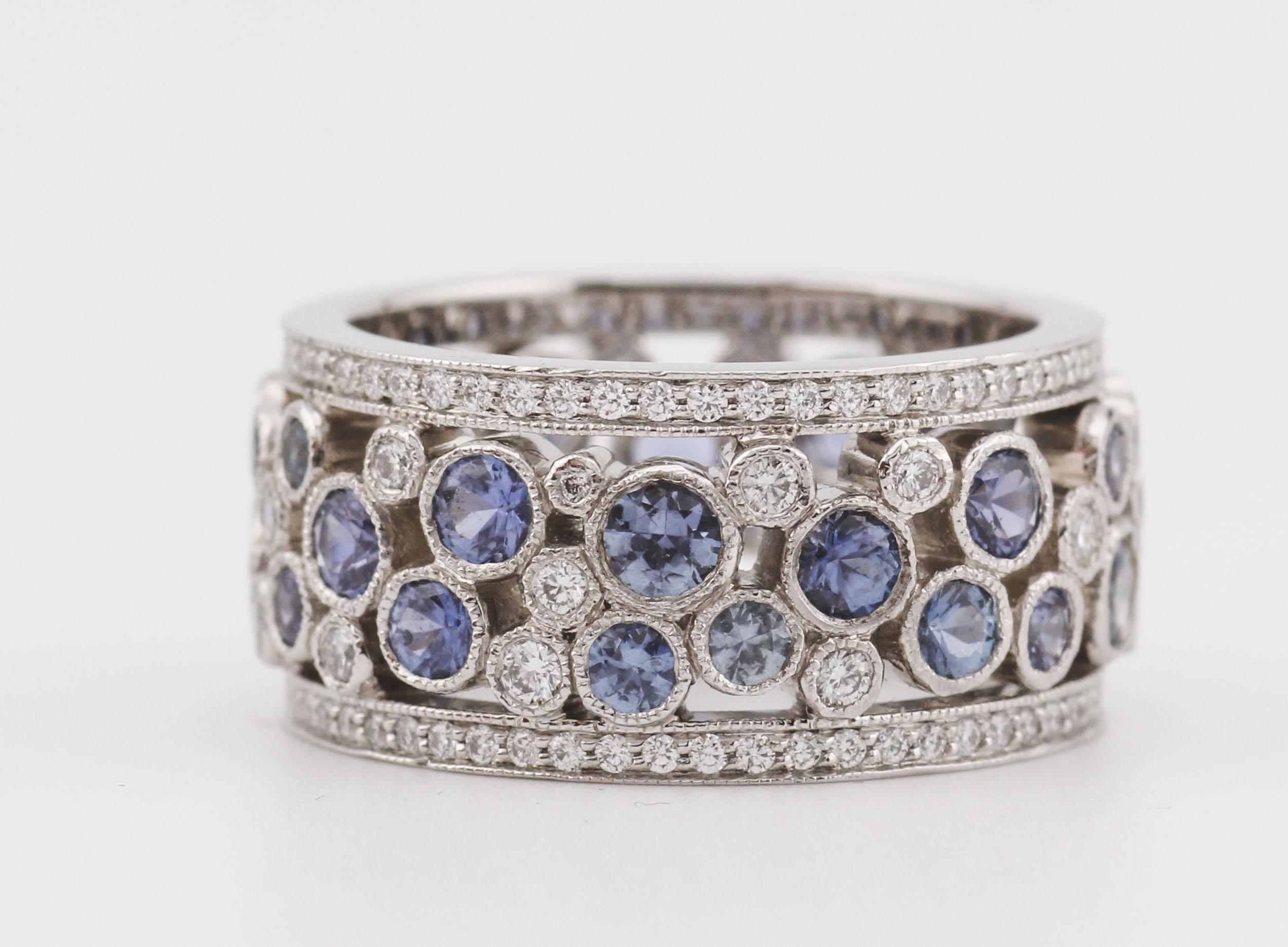 The Tiffany & Co. Diamond & Sapphire Platinum Cobblestone Band Ring is a breathtaking testament to the brand’s mastery of timeless elegance and refined craftsmanship. Designed to capture the brilliance of a starry night, this exquisite band is