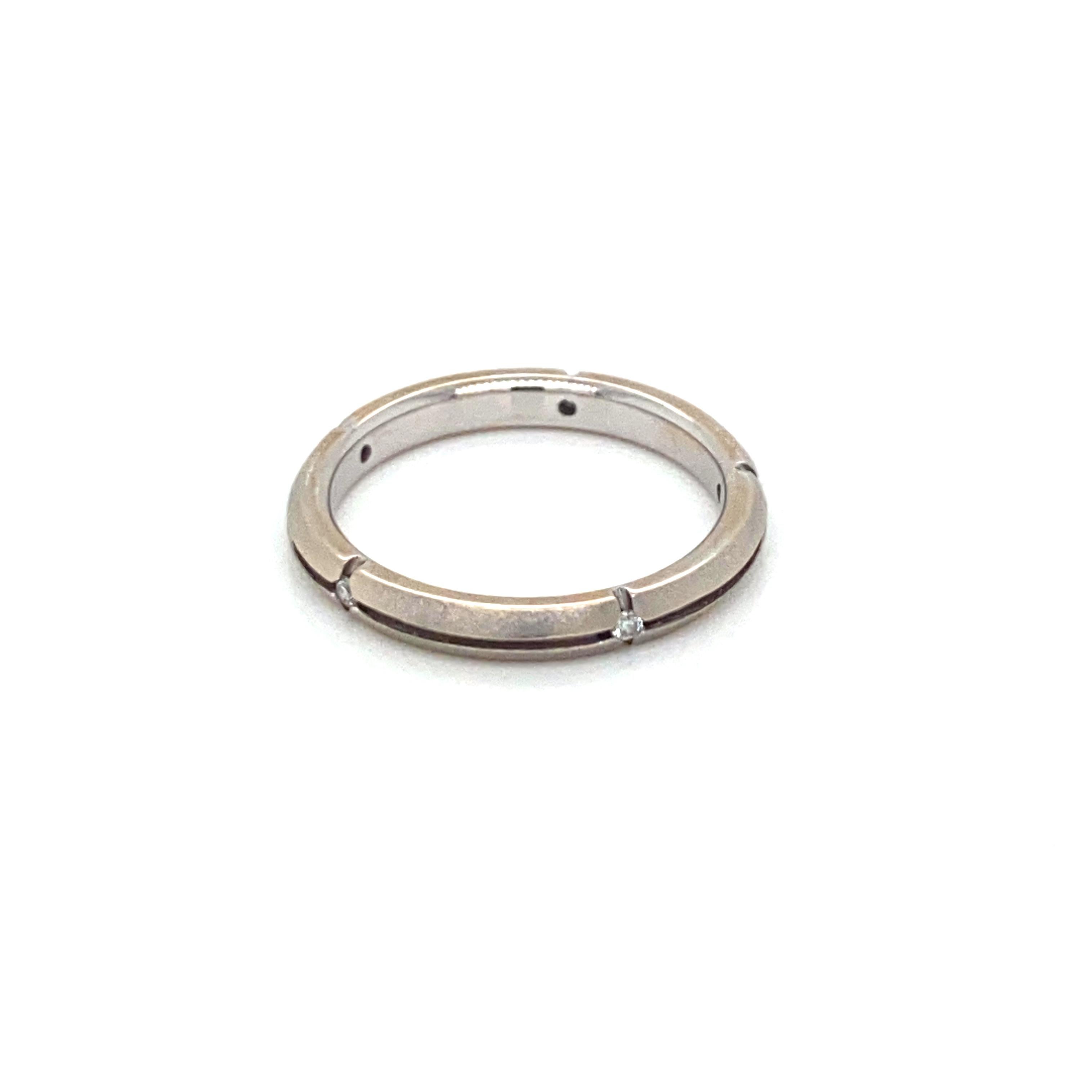 Simply and classy, this elegant Tiffany & Co. Diamond Satin Band Gold Ring, is made in solid 18k white gold and it is set with five sparkling round brilliant cut Diamond. Numbered and hallmarked inside the band, it comes with original Tiffany & Co.