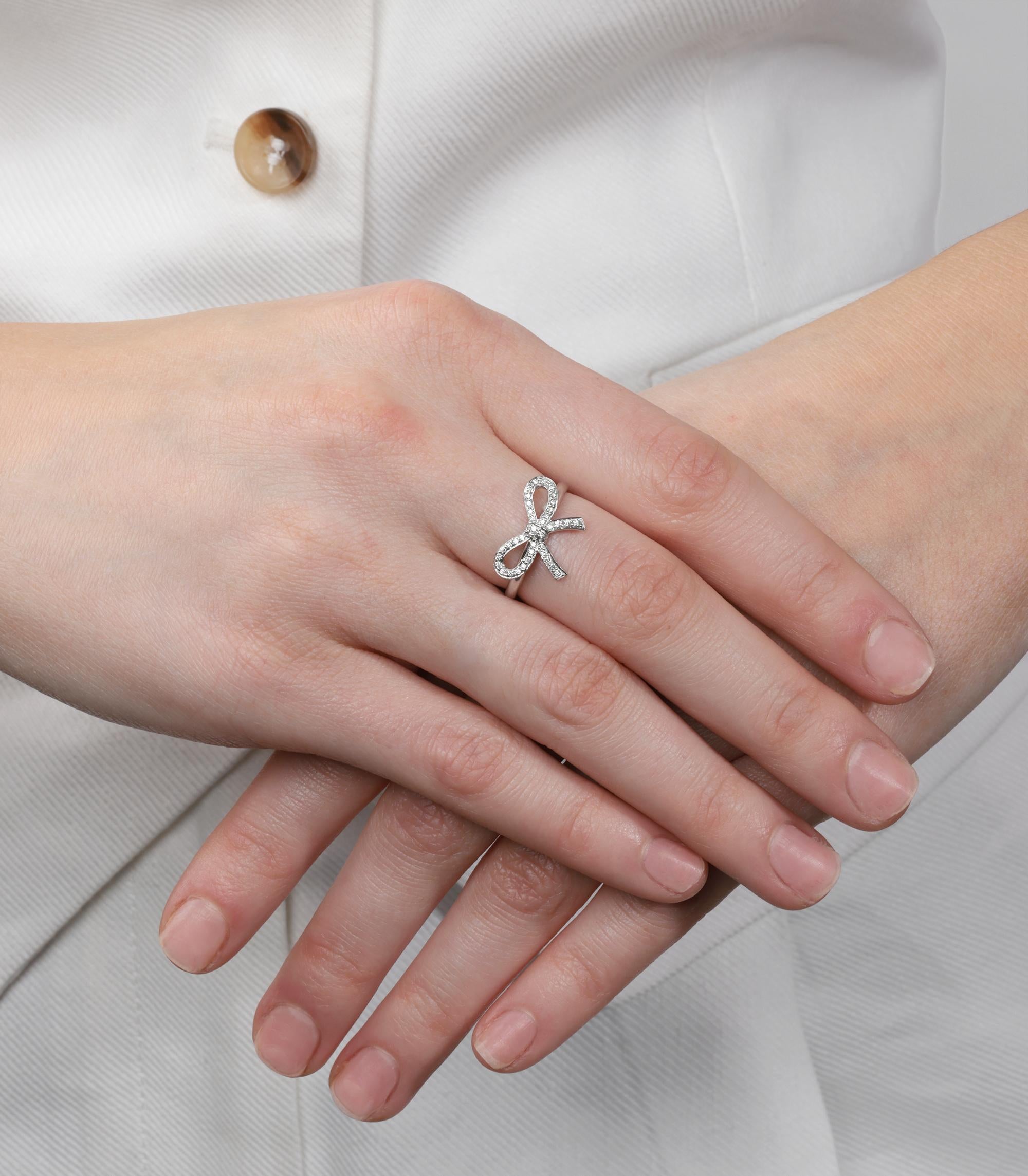 Tiffany & Co. Diamond Set Platinum Bow Ring

Product Details
Xupes Ref: COMJ783
Brand: Tiffany & Co.
Model: Bow Ring
Type: Ring 
RRP: £2,500
Accompanied By: Tiffany & Co. Box  
Material(s): Platinum
Gemstone: Diamond 
UK Ring Size: M
EU Ring Size: