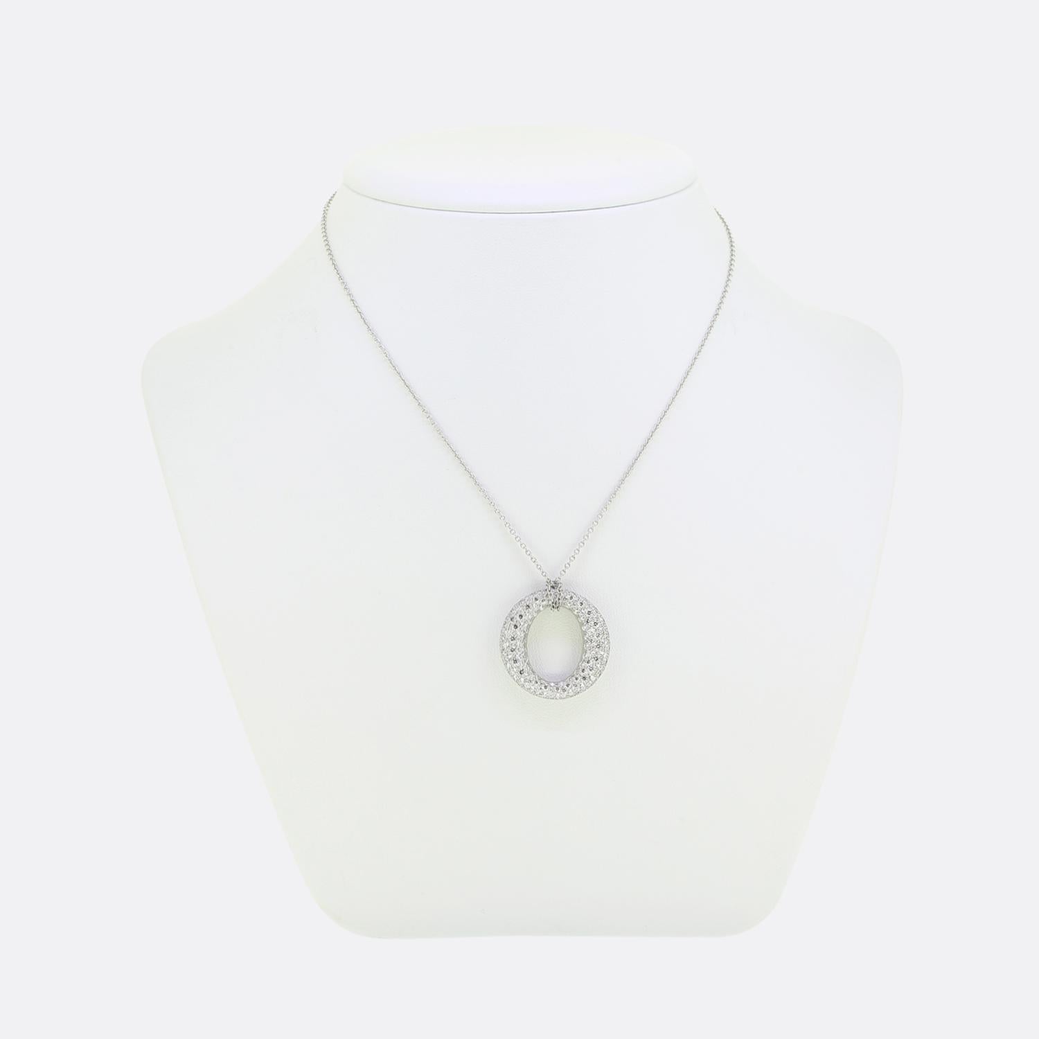 Here we have a stunning necklace from the world renowned jewellery designer, Tiffany & Co. This piece is taken from a limited edition Elsa Peretti collection named Sevillana and is composed of a platinum circle motif completely pave set with
