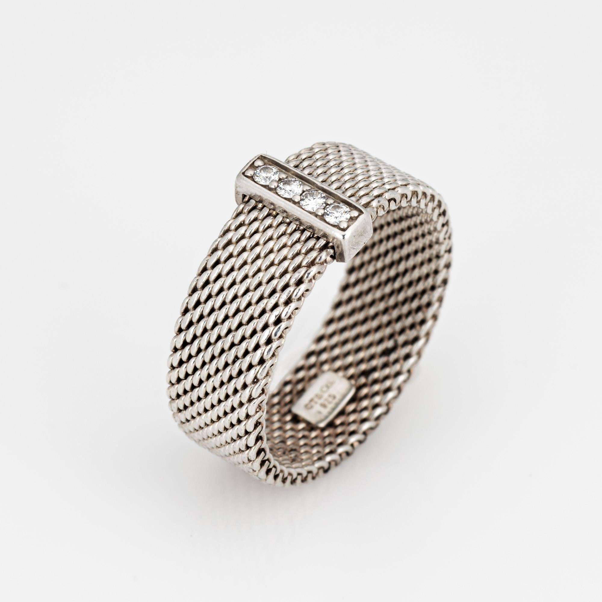 Pre-owned Tiffany & Co Somerset ring crafted in sterling silver.  

Diamonds total an estimated 0.05 carats (estimated at H-I color and VS2 clarity).
The classic mesh band is set with a strand of diamonds to the center. The 7mm wide band (0.27