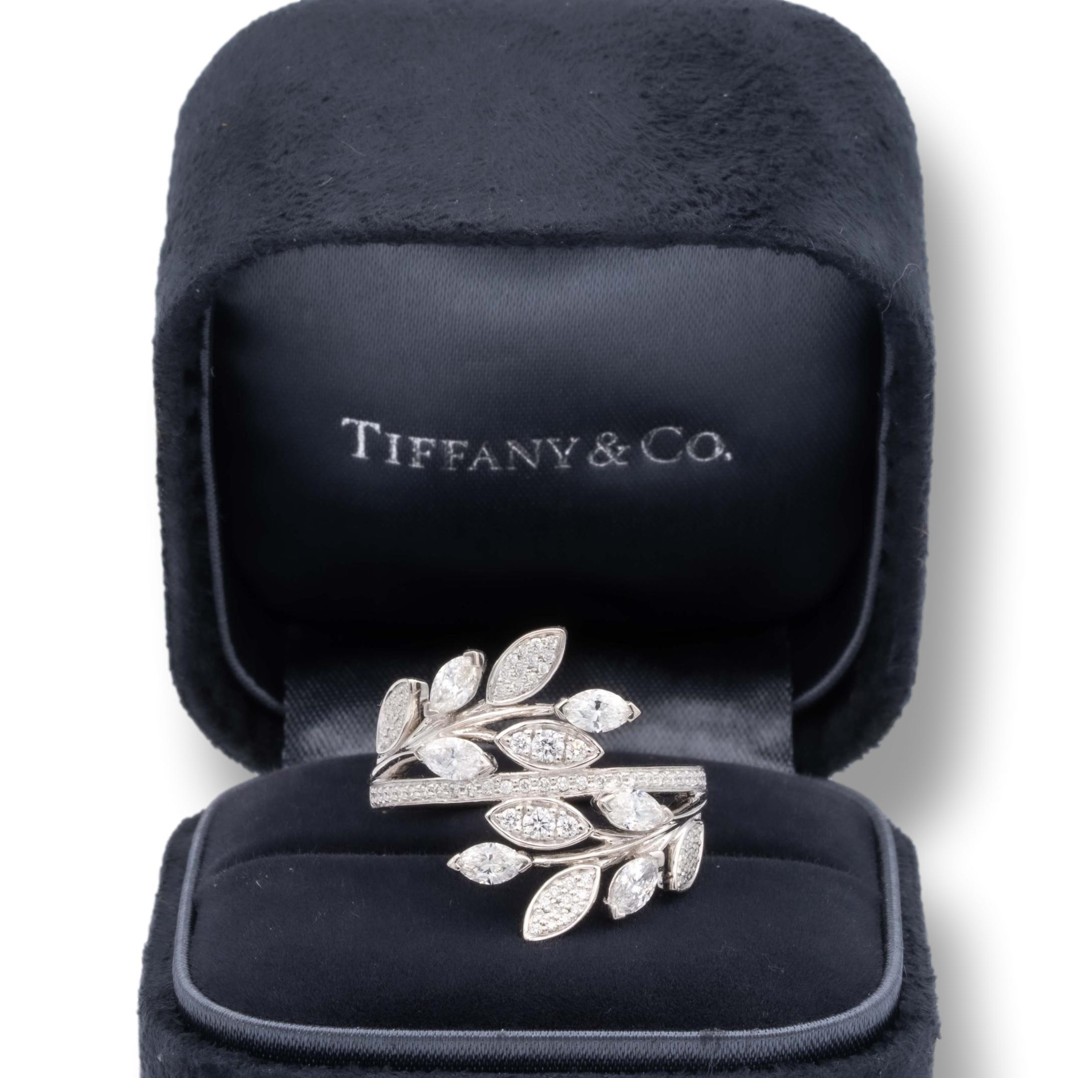 Tiffany & Co. Victoria Bypass ring finely crafted in platinum with 82 bead set round brilliant cut diamonds and 6 marquise shaped diamonds weighing 1.19 carats total weight. F-G Color, VVS- Vs clarity

Stamp: © Tiffany & Co. Pt950
Size: 7 - Can be