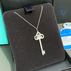 Tiffany & Co. Diamond White Gold Fleur de Lis Key Pendant Necklace Medium