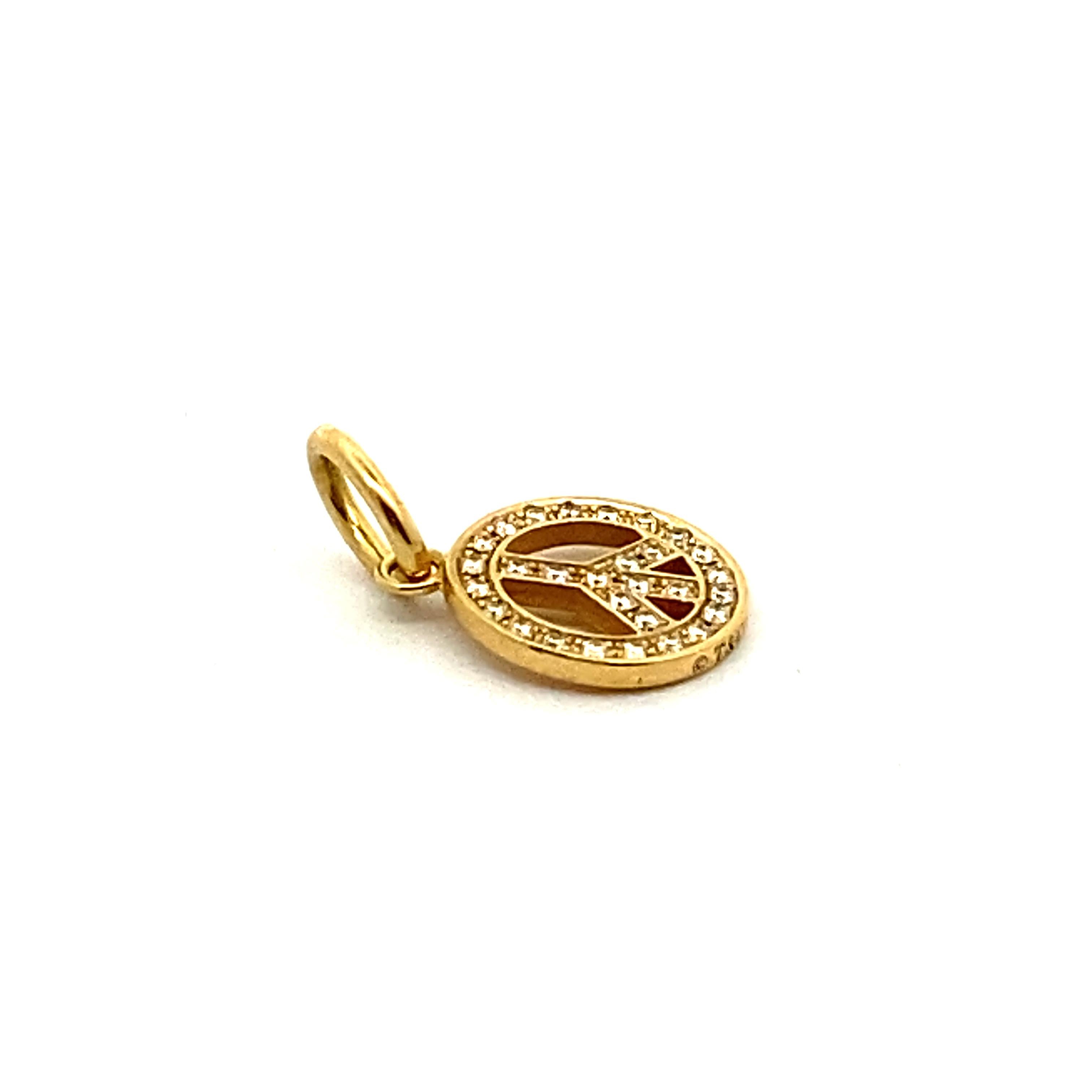 Tiffany & Co 18ky Metro diamond peace charm pendant .7Dwt Marked  ©T&Co 750 Italy