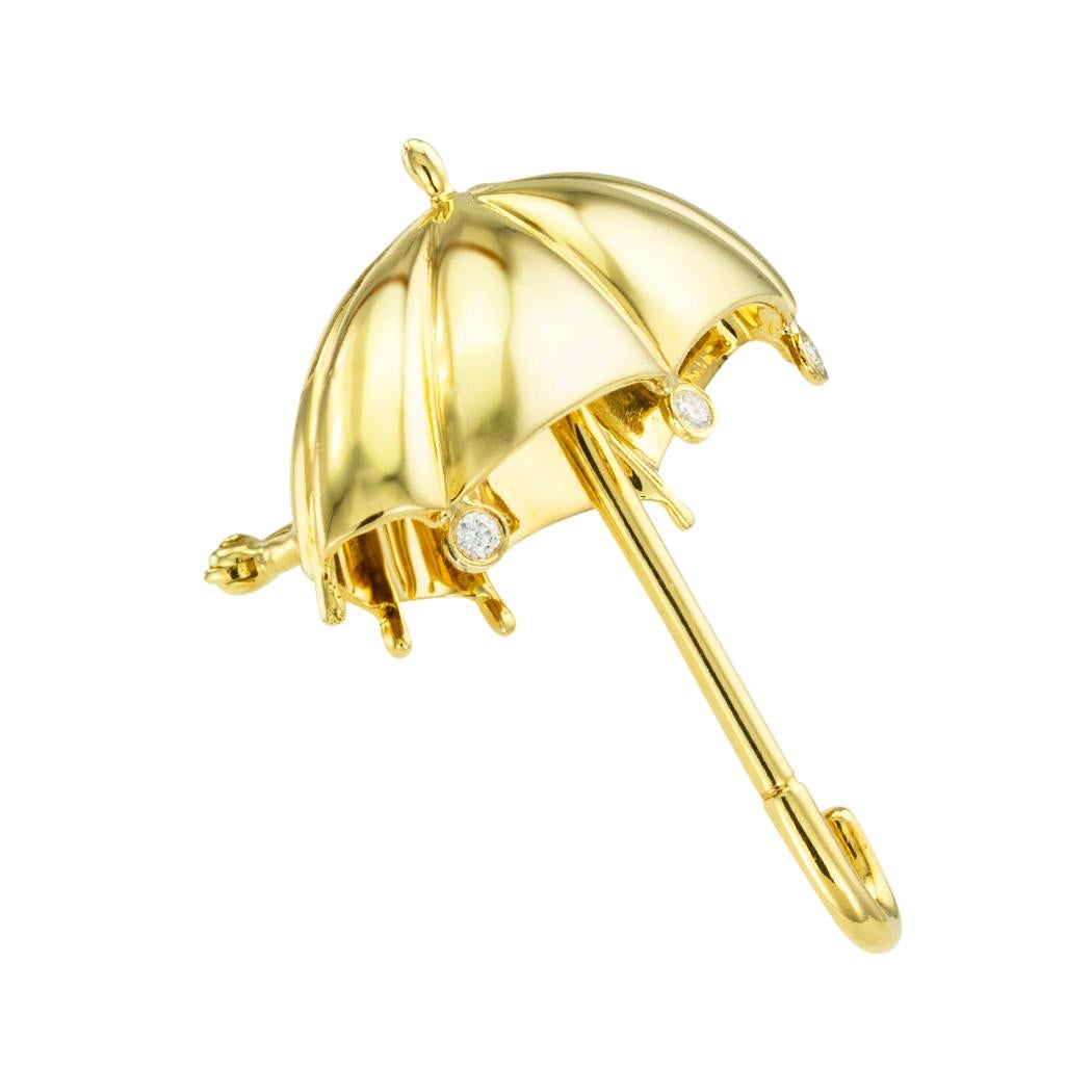  Tiffany & Co. yellow gold and diamond figural umbrella brooch circa 1980. *

ABOUT THIS ITEM:  # P-DJ75F. Scroll down for detailed specifications. This fanciful, gleaming gold and sparkling diamonds Tiffany & Co. umbrella brooch deserves a place in