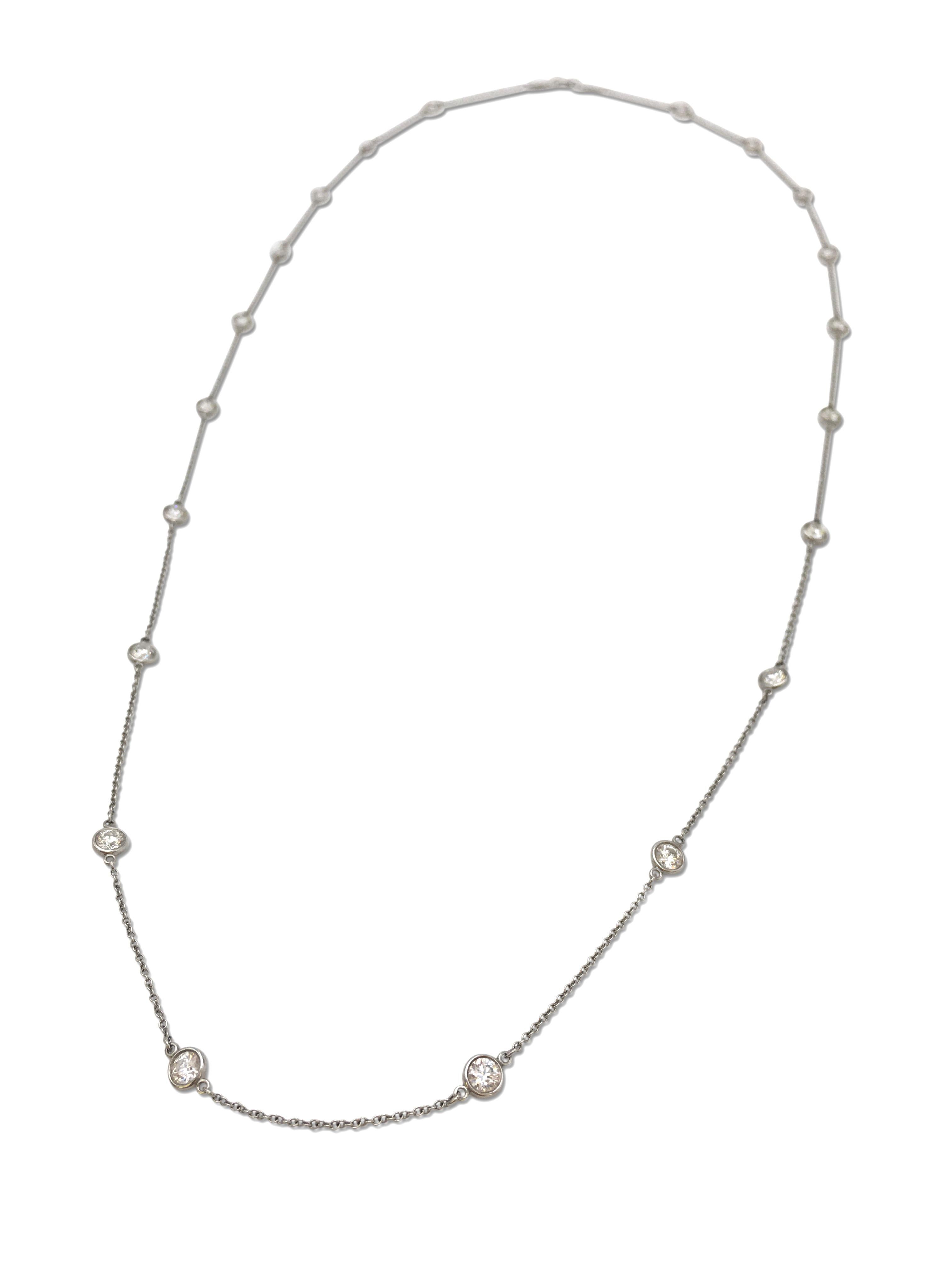 Authentic Tiffany & Co. Elsa Peretti Diamonds by the Yard necklace. Bezel-set round brilliant cut diamonds (E-F in color, VS clarity) of an estimated 3.50 cttw in platinum. Signed Tiffany & Co., Peretti, PT 950, The necklace is 30 inches in length.