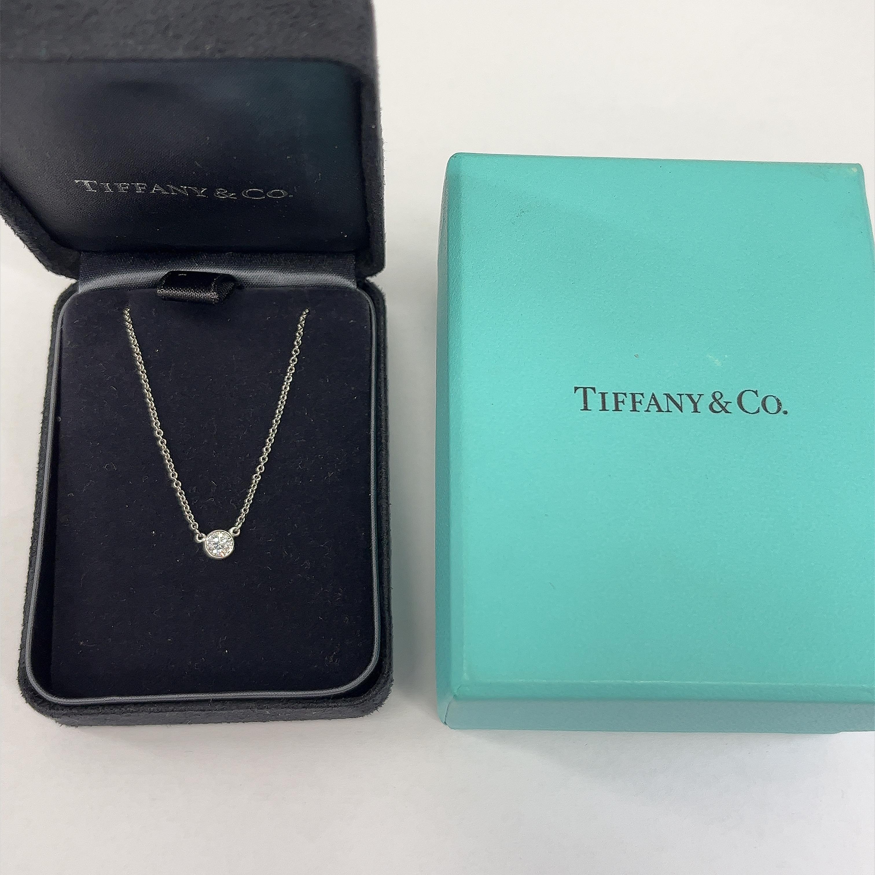 This Tiffany & Co diamonds by the Yard Single diamond
necklace is designed to hold the pendant at the center of the chest,
set with 1 round brilliant cut diamond 0.25ct G/VS1
making it a very elegant and beautiful piece of jewellery. 

Total Diamond